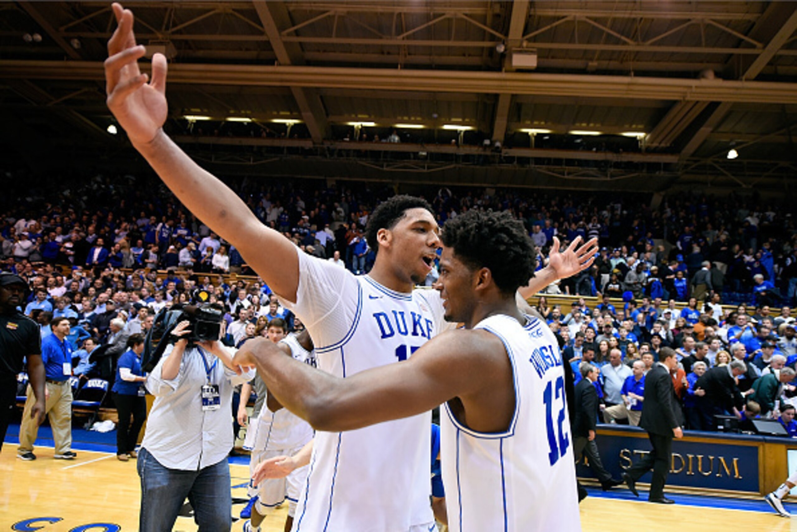 DURHAM, NC - FEBRUARY 18:  Jahlil Okafor #15 and Justise Winslow #12 of the Duke Blue Devils celebrate after a win against the North Carolina Tar Heels  at Cameron Indoor Stadium on February 18, 2015 in Durham, North Carolina. Duke won 92-90 in overtime. 