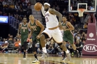 Dec 2, 2014; Cleveland, OH, USA; Cleveland Cavaliers forward LeBron James (23) throws a bounce pass in the first quarter against the Milwaukee Bucks at Quicken Loans Arena. Mandatory Credit: David Richard-USA TODAY Sports