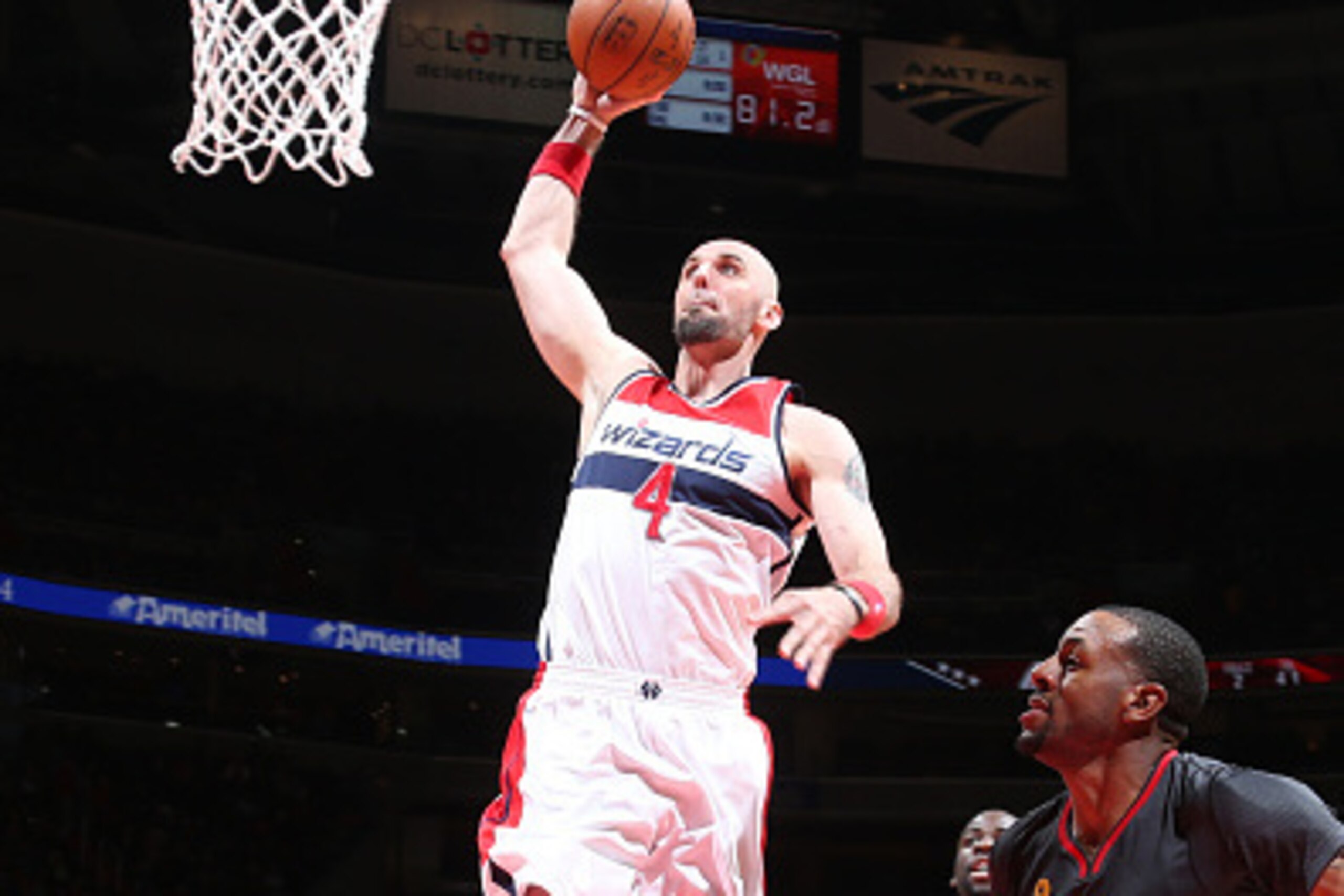 WASHINGTON, DC -  FEBRUARY 24: Marcin Gortat #4 of the Washington Wizards dunks against the Golden State Warriors on February 24, 2015 at Verizon Center in Washington, DC. NOTE TO USER: User expressly acknowledges and agrees that, by downloading and or us
