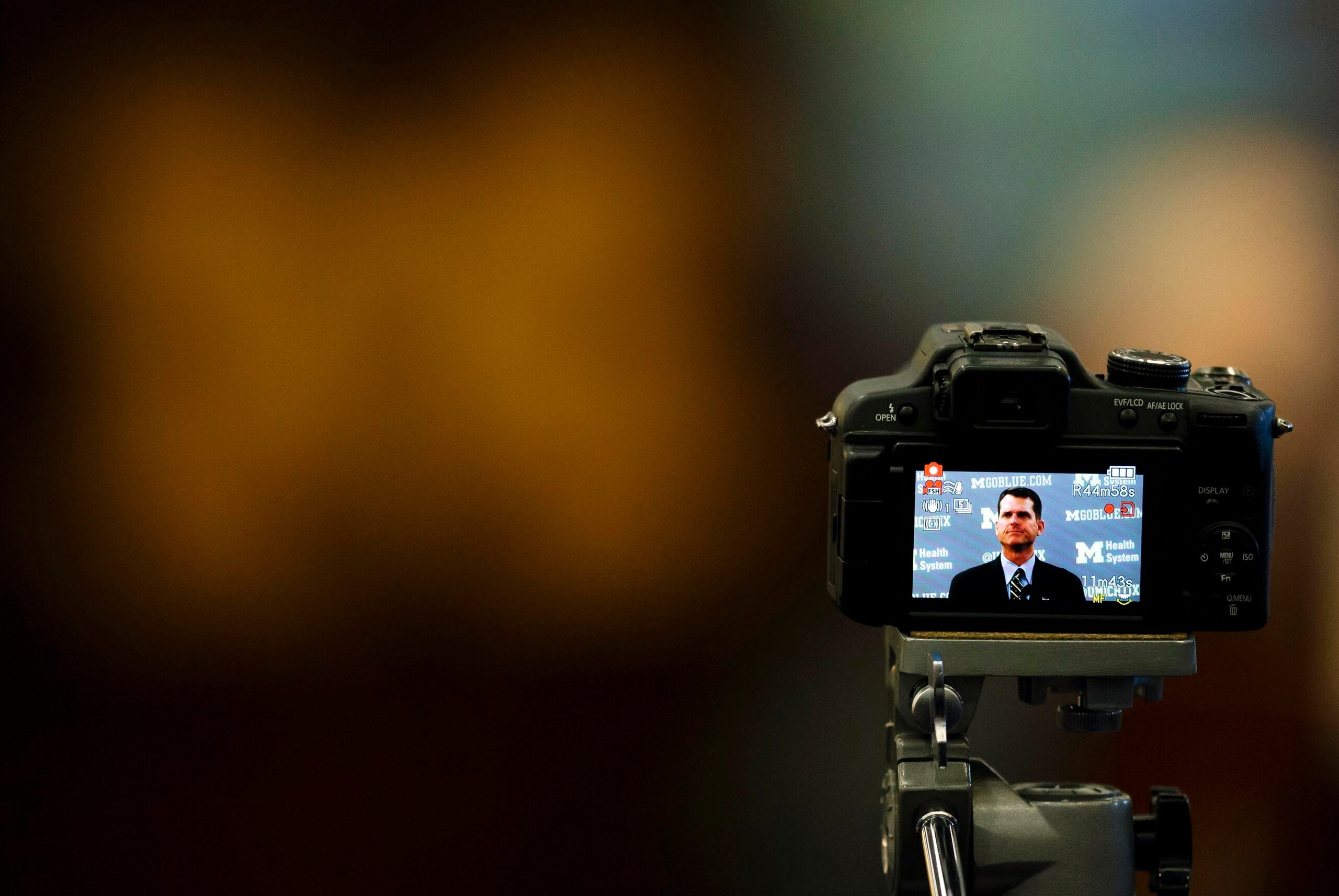 Dec 30, 2014; Ann Arbor, MI, USA; Camera video tapes Jim Harbaugh as he speaks to the media after he is introduced as the new head football coach of the Michigan Wolverines at Jonge Center. Mandatory Credit: Rick Osentoski-USA TODAY Sports