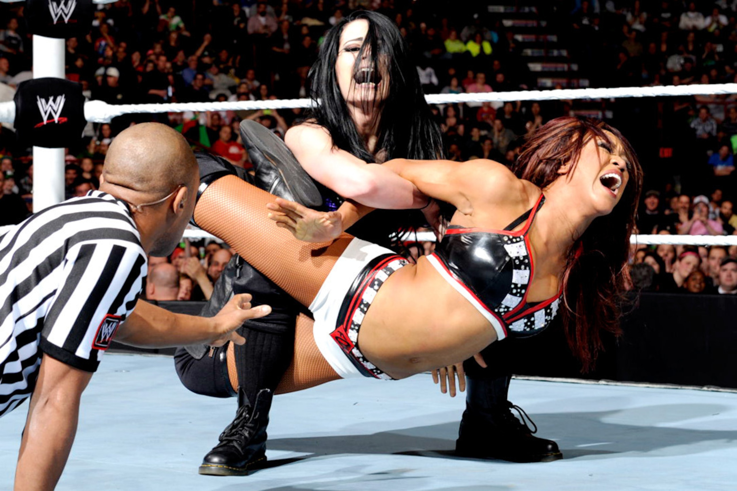 Paige puts the PTO on Alicia Fox.