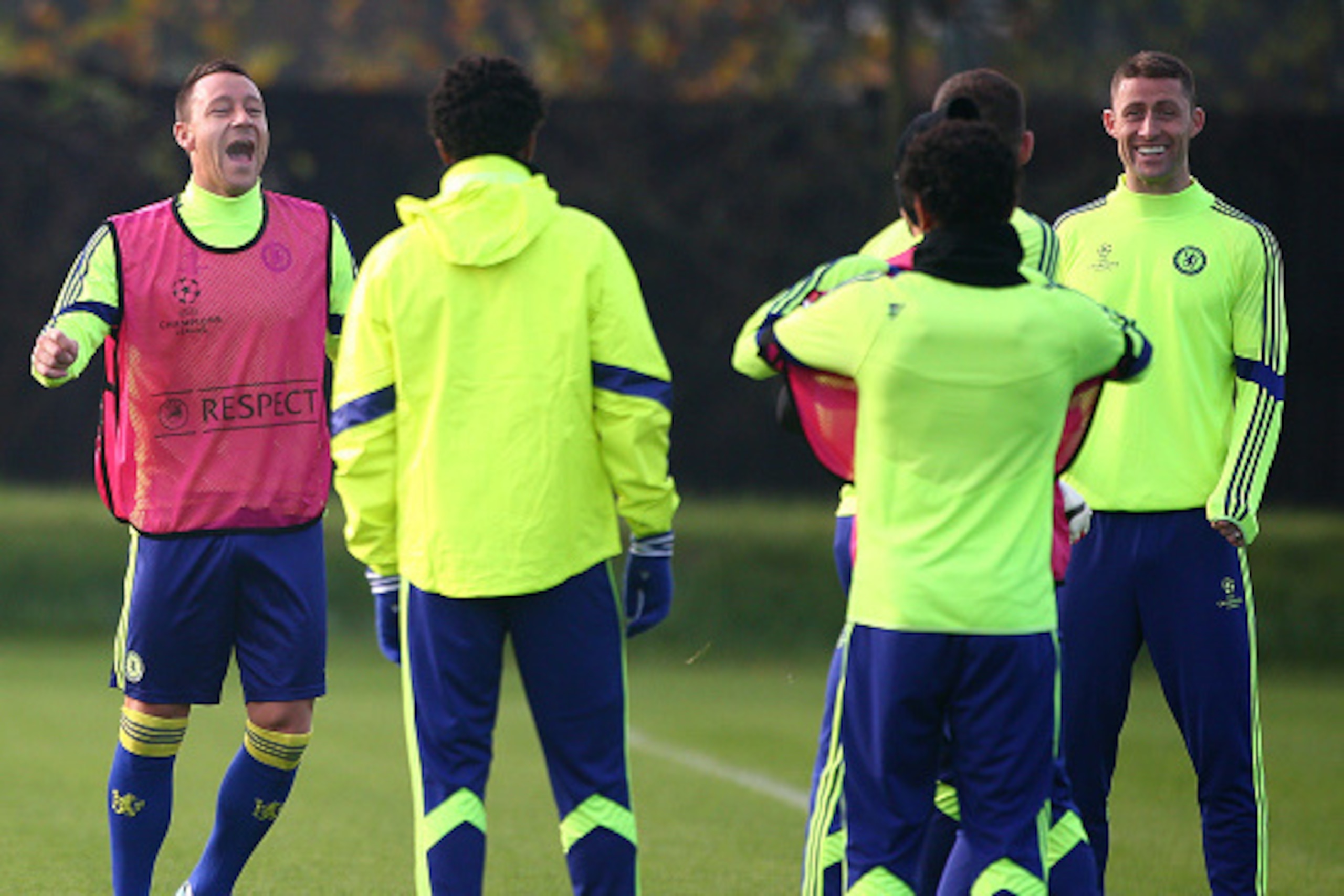 COBHAM, ENGLAND - NOVEMBER 24: Chelsea's John Terry (L) and Gary Cahill joke around in the warm up during a Chelsea Training Session ahead of their Champions League fixture against FC Schalke on November 24, 2014 in Cobham, England. (Photo by Charlie Crow