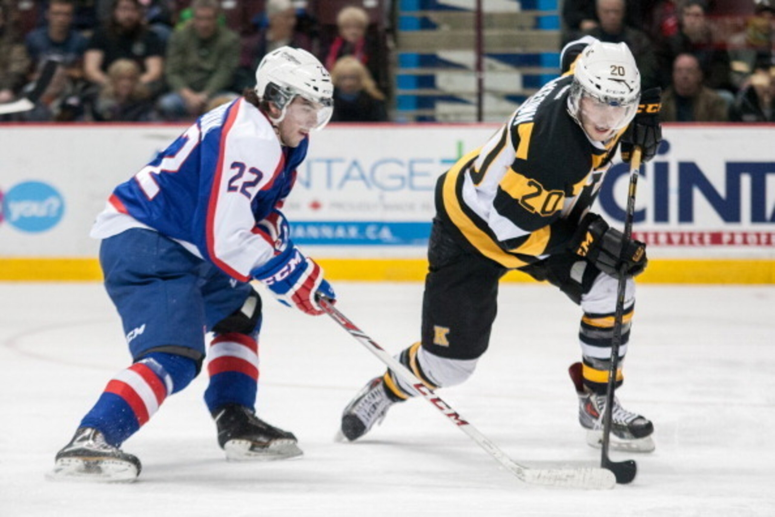 WINDSOR, ON - JANUARY 30: Roland McKeown #20 of the Kingston Frontenacs drives past Sam Povorozniouk #22 of the Windsor Spitfires on January 30, 2014 at the WFCU Centre in Windsor, Ontario, Canada. (Photo by Dennis Pajot/Getty Images)