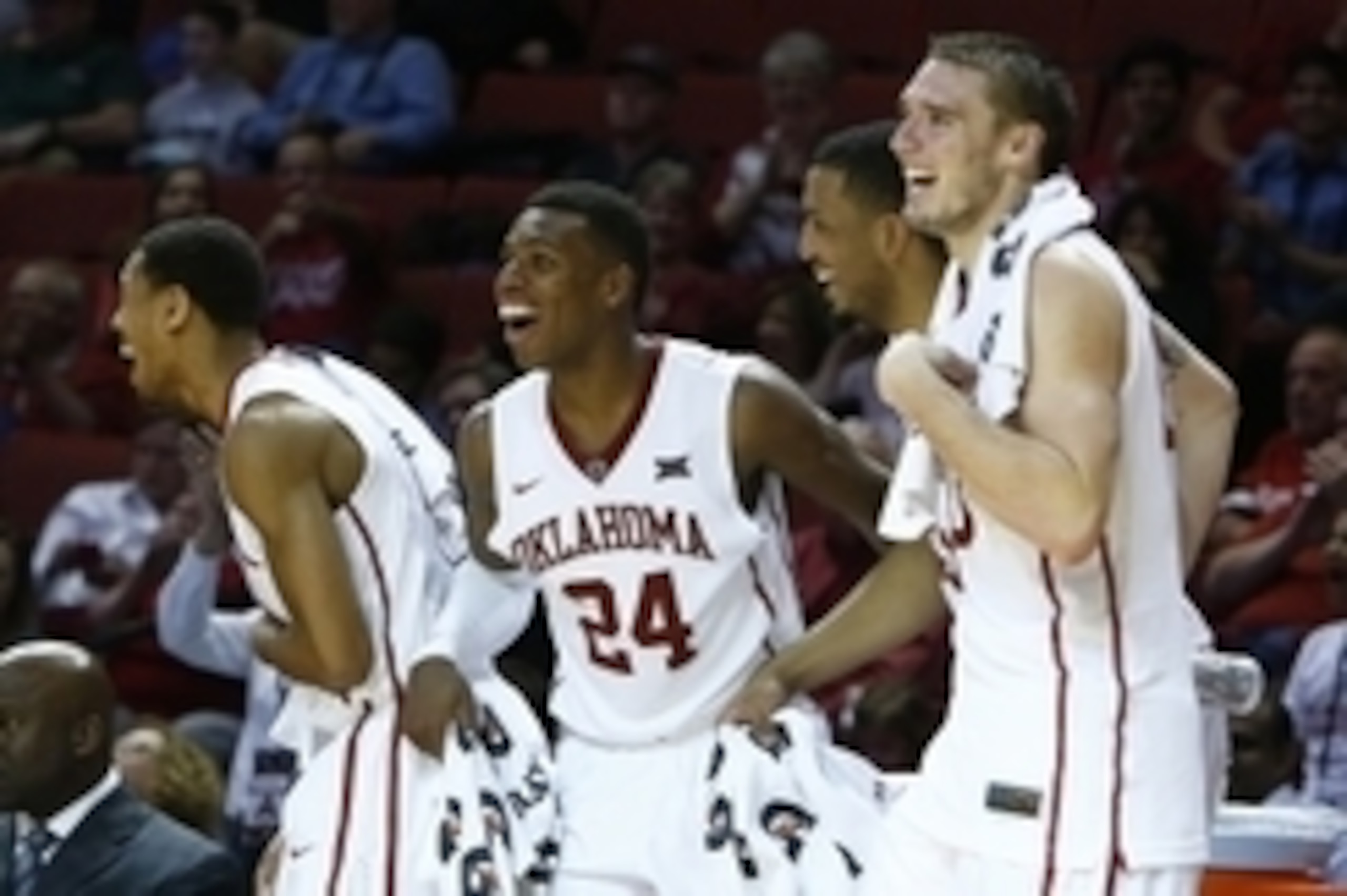 Jan 28, 2015; Norman, OK, USA; Oklahoma Sooners guard Isaiah Cousins (11), guard Buddy Hield (24), forward TaShawn Thomas (35), and forward Ryan Spangler (00) react to a play against the Texas Tech Red Raiders during the second half at Lloyd Noble Center.