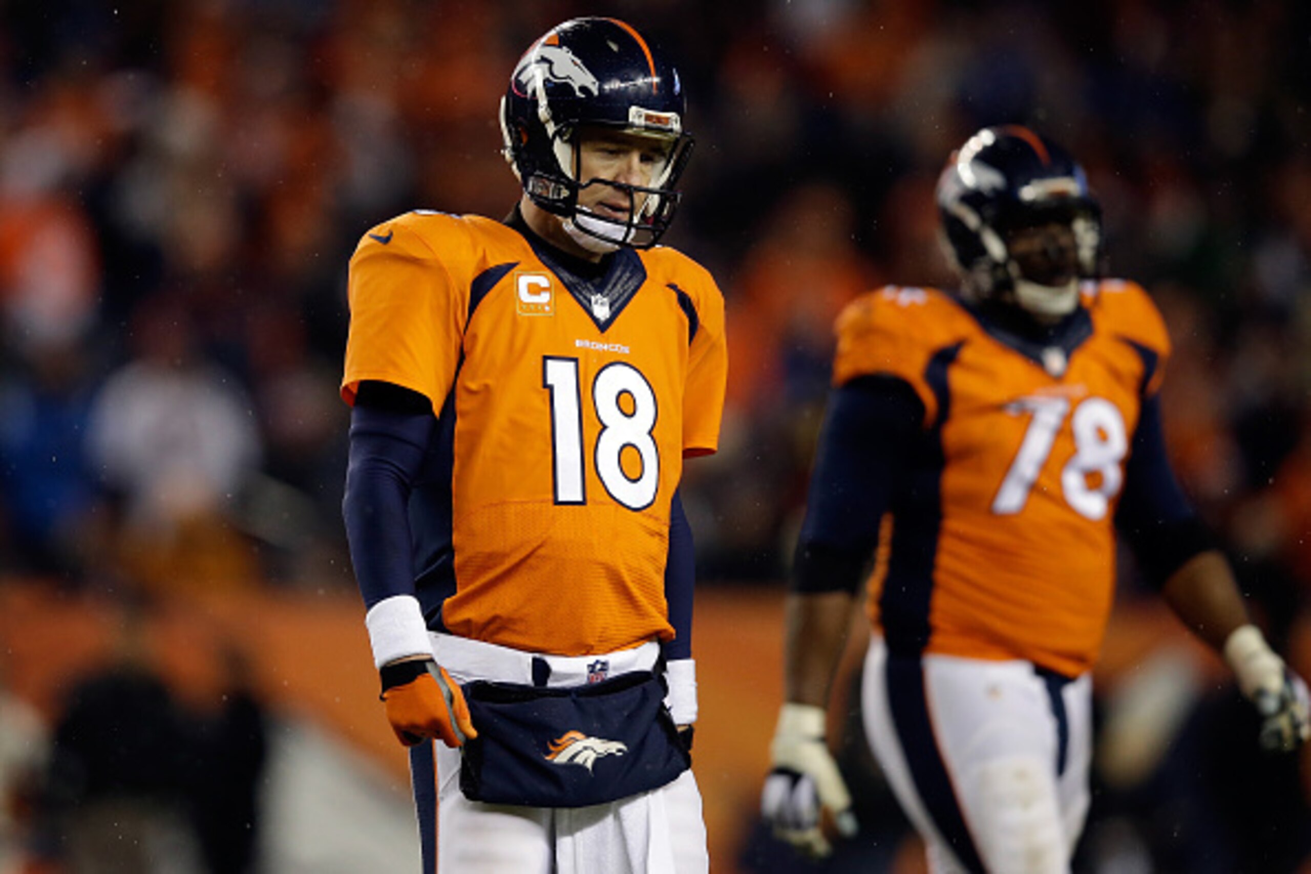 DENVER, CO - JANUARY 11:  Peyton Manning #18 of the Denver Broncos reacts in the fourth quarter against the Indianapolis Colts during a 2015 AFC Divisional Playoff game at Sports Authority Field at Mile High on January 11, 2015 in Denver, Colorado. The Co