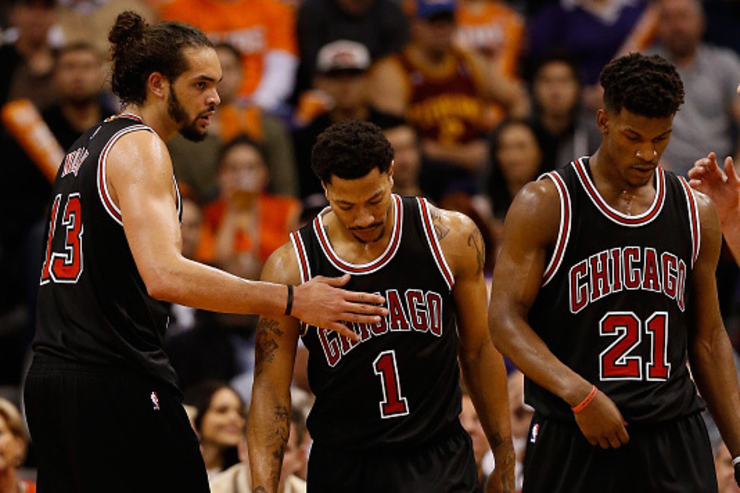 PHOENIX, AZ - JANUARY 30:  Joakim Noah #13, Derrick Rose #1 and Jimmy Butler #21 of the Chicago Bulls react during the second half of the NBA game against the Phoenix Suns at US Airways Center on January 30, 2015 in Phoenix, Arizona. The Suns defeated the