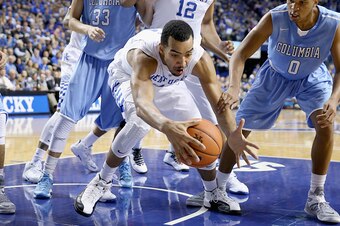 LEXINGTON, KY - DECEMBER 10:  Trey Lyles #41 of the Kentucky Wildcats grabs a loose ball during the game against the Columbia Lions at Rupp Arena on December 10, 2014 in Lexington, Kentucky.  (Photo by Andy Lyons/Getty Images)