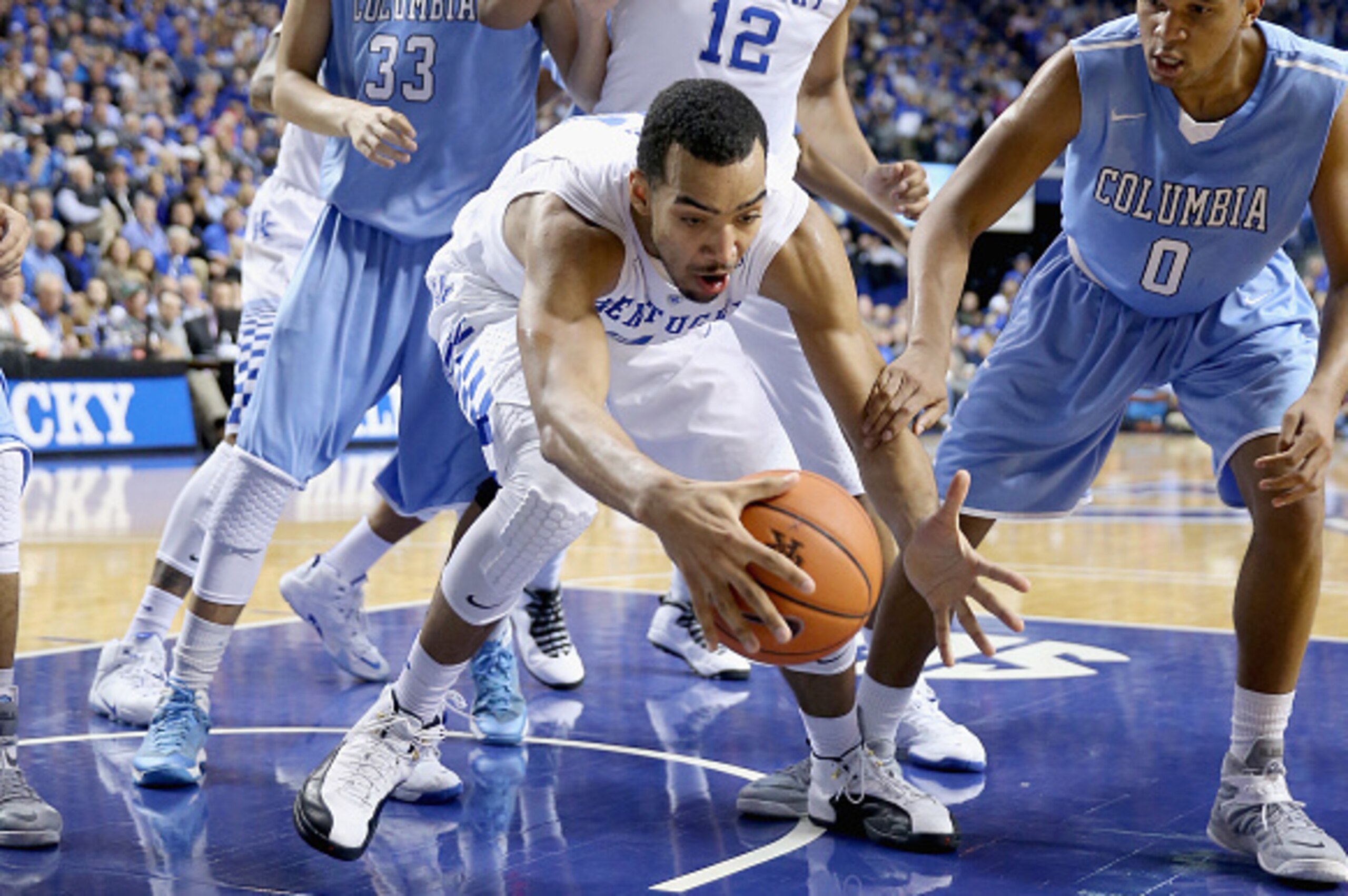 LEXINGTON, KY - DECEMBER 10:  Trey Lyles #41 of the Kentucky Wildcats grabs a loose ball during the game against the Columbia Lions at Rupp Arena on December 10, 2014 in Lexington, Kentucky.  (Photo by Andy Lyons/Getty Images)