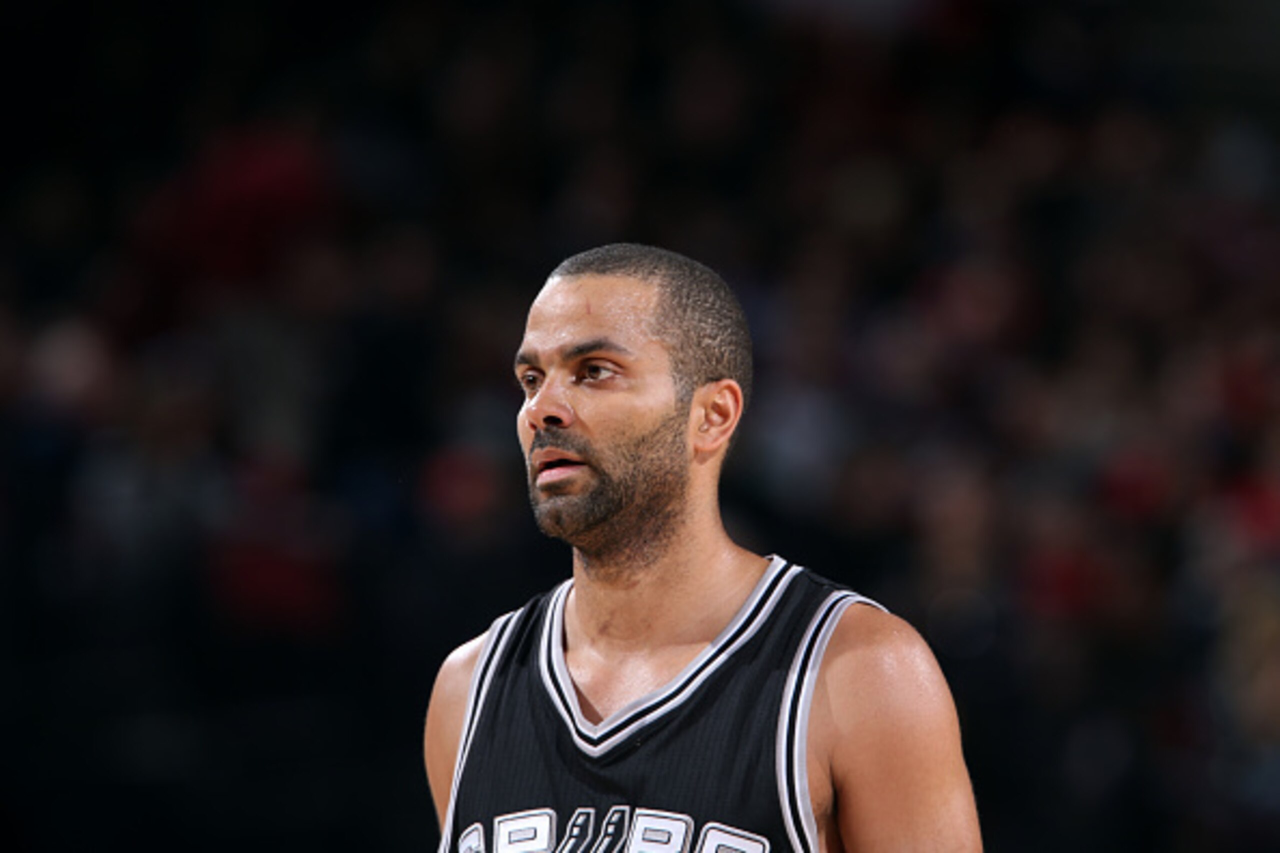 PORTLAND, OR - FEBRUARY 25: Tony Parker #9 of the San Antonio Spurs stands on the court during a game against the Portland Trail Blazers on February 25, 2015 at the Moda Center in Portland, Oregon. NOTE TO USER: User expressly acknowledges and agrees that