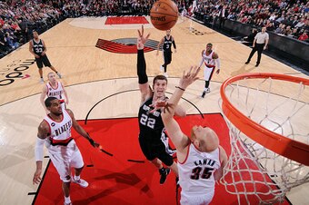 PORTLAND, OR - FEBRUARY 25: Tiago Splitter #22 of the San Antonio Spurs shoots against the Portland Trail Blazers on February 25, 2015 at the Moda Center in Portland, Oregon. NOTE TO USER: User expressly acknowledges and agrees that, by downloading and or
