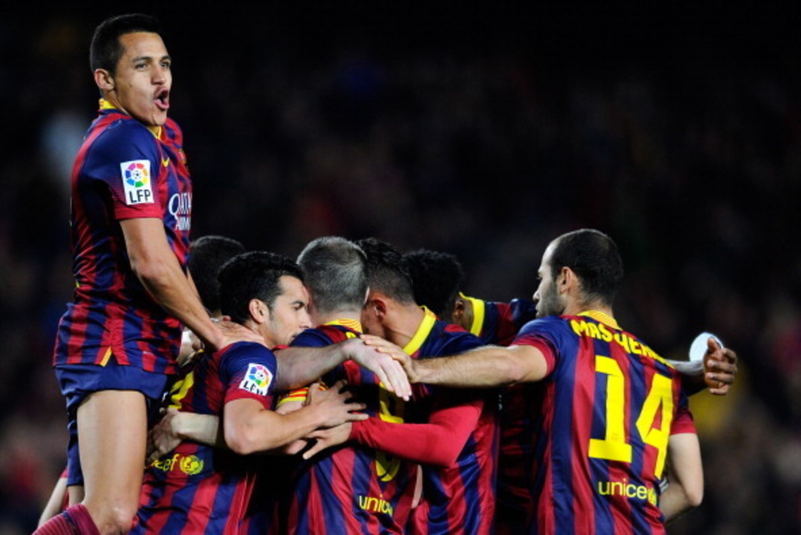 BARCELONA, SPAIN - APRIL 20:  Alexis Sanchez of FC Barcelona celebrates with his teammates after Lionel Messi of FC Barcelona scored his team's second goal during the La Liga match between FC Barcelona and Athletic Club at Camp Nou on April 20, 2014 in Ba