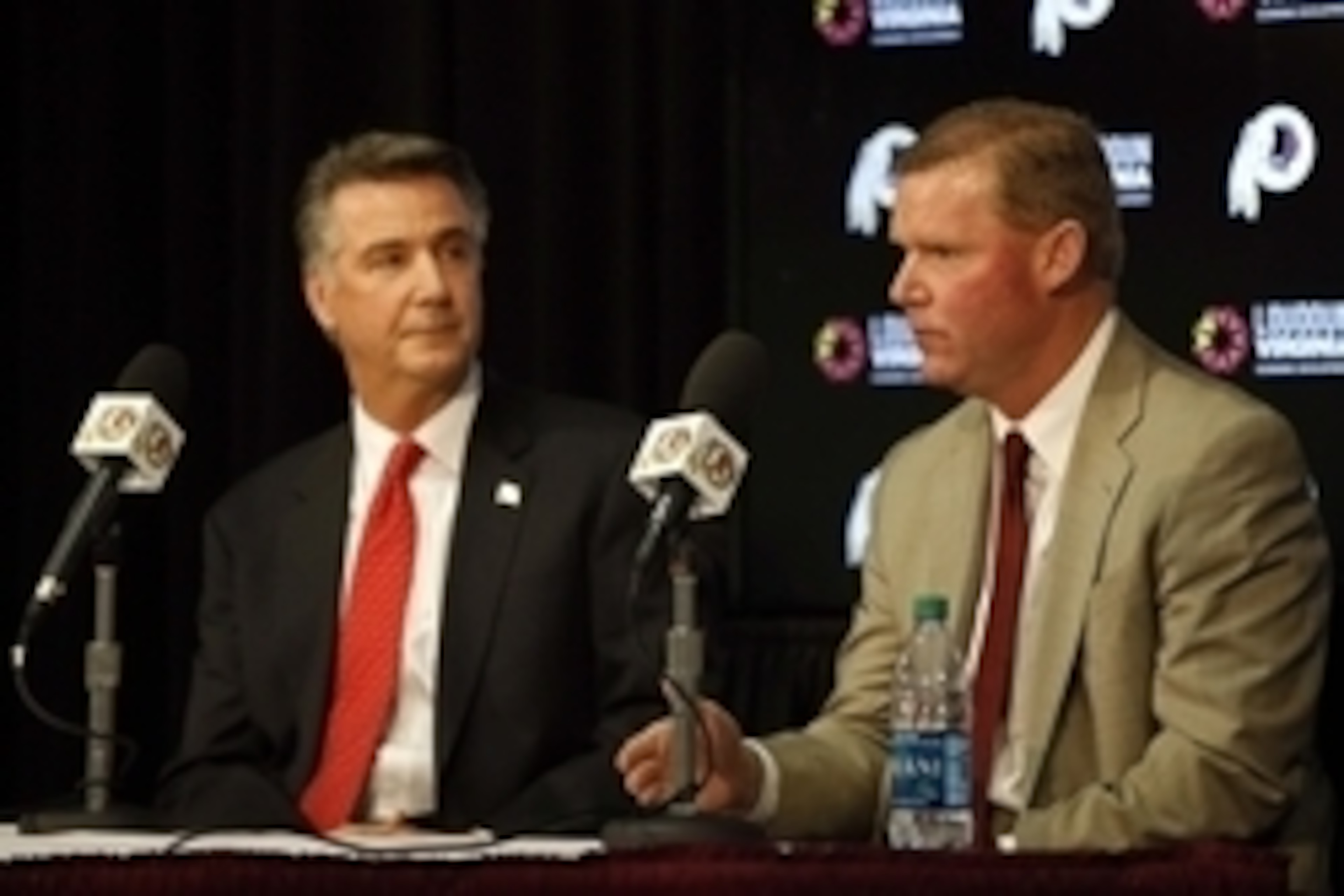 Jan 9, 2015; Ashburn, VA, USA; Washington Redskins president Bruce Allen (left) listens as Washington Redskins new general manager Scot McCloughan (right) speaks during his introductory press conference at Redskins Park. Mandatory Credit: Geoff Burke-USA 