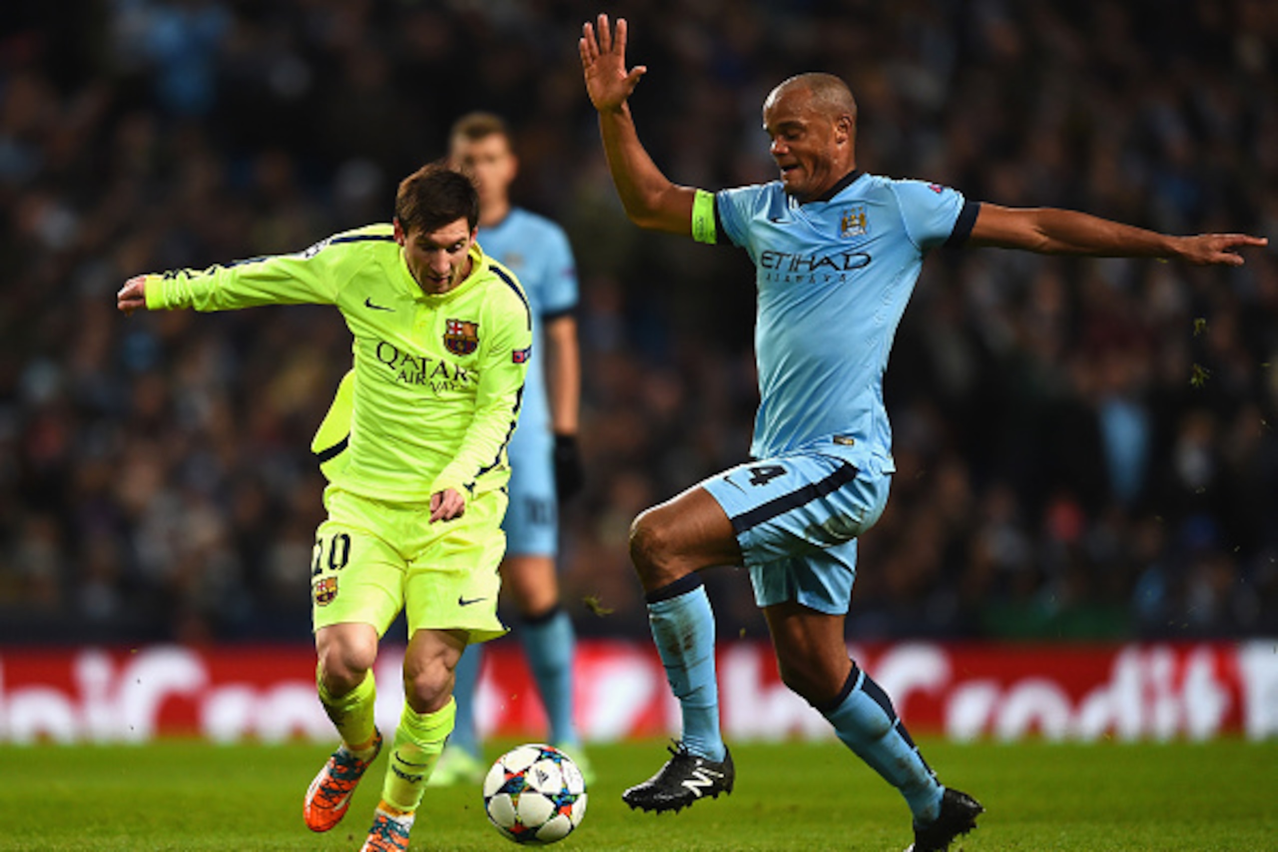 MANCHESTER, ENGLAND - FEBRUARY 24: Vincent Kompany of Manchester City challenges Lionel Messi of Barcelona during the UEFA Champions League Round of 16 match between Manchester City and Barcelona at Etihad Stadium on February 24, 2015 in Manchester, Unit MANCHESTER, ENGLAND - FEBRUARY 24: Vincent Kompany of Manchester City challenges Lionel Messi of Barcelona during the UEFA Champions League Round of 16 match between Manchester City and Barcelona at Etihad Stadium on February 24, 2015 in Manchester, Unit