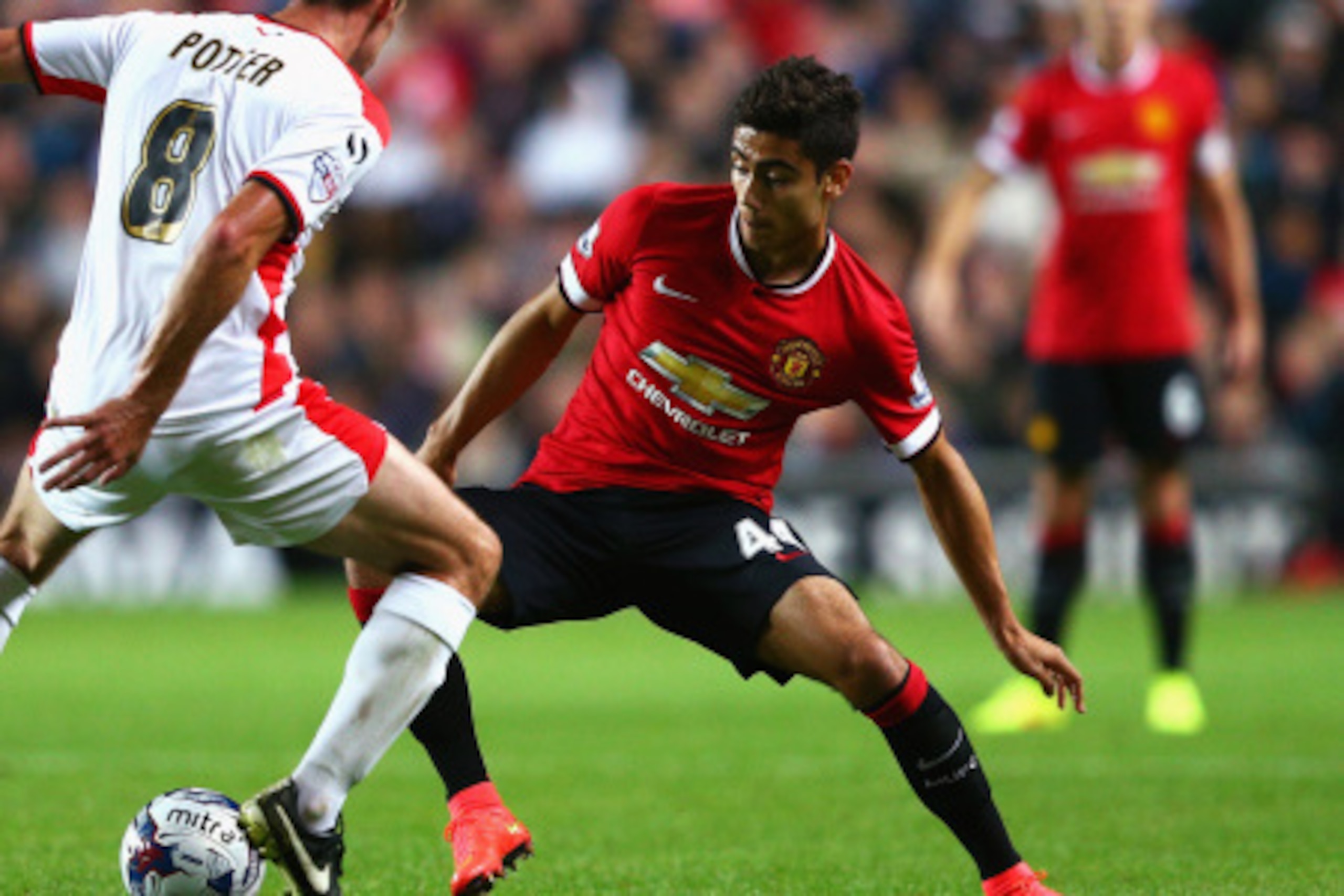 MILTON KEYNES, ENGLAND - AUGUST 26: Andreas Pereira of Manchester United takes on Darren Potter of Milton Keynes Dons during the Capital One Cup Second Round match between MK Dons and Manchester United at Stadium mk on August 26, 2014 in Milton Keynes, En