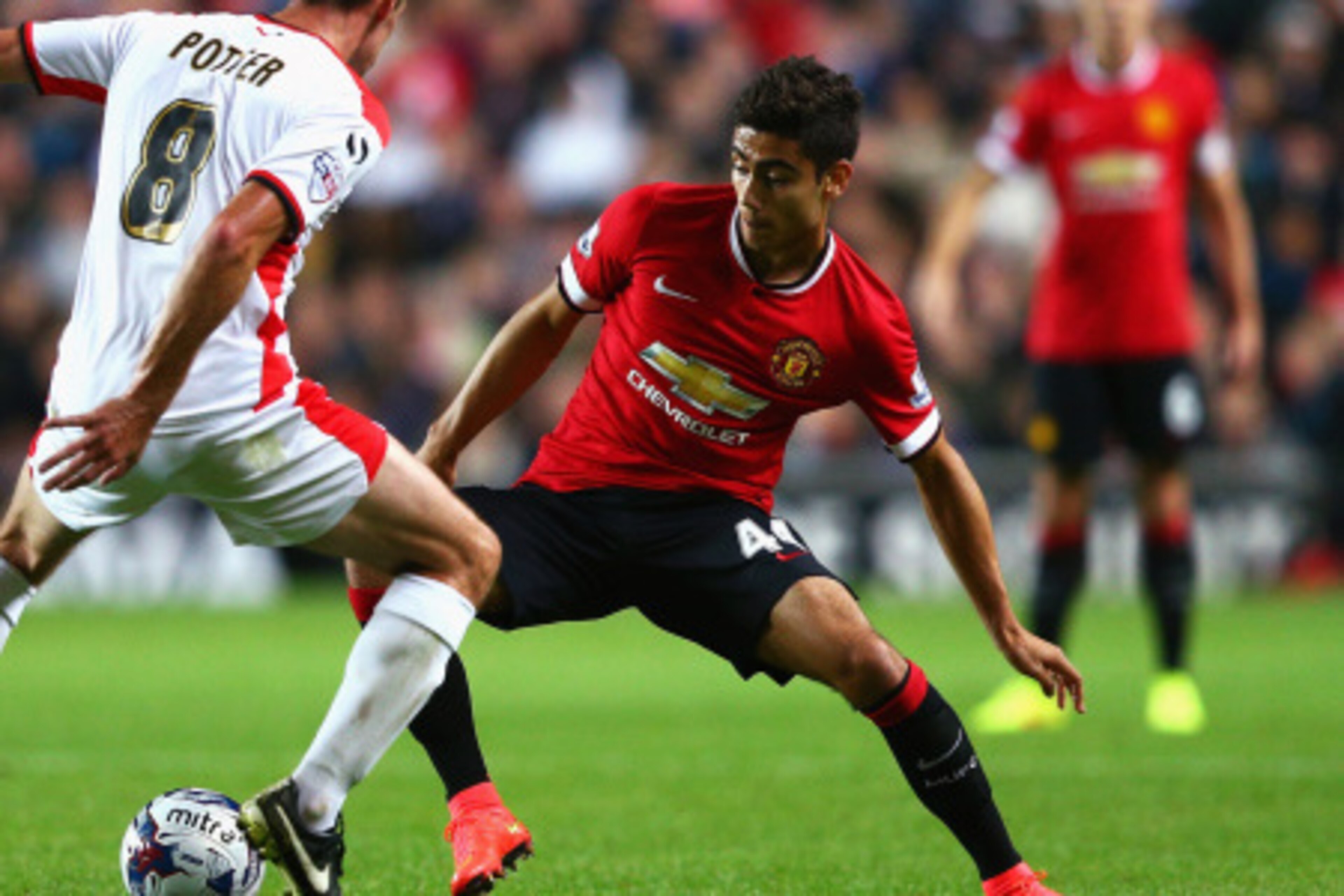 MILTON KEYNES, ENGLAND - AUGUST 26: Andreas Pereira of Manchester United takes on Darren Potter of Milton Keynes Dons during the Capital One Cup Second Round match between MK Dons and Manchester United at Stadium mk on August 26, 2014 in Milton Keynes, En MILTON KEYNES, ENGLAND - AUGUST 26: Andreas Pereira of Manchester United takes on Darren Potter of Milton Keynes Dons during the Capital One Cup Second Round match between MK Dons and Manchester United at Stadium mk on August 26, 2014 in Milton Keynes, En