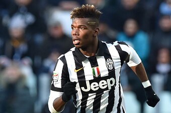 TURIN, ITALY - JANUARY 25:  Paul Pogba of Juventus FC in action during the Serie A match between Juventus FC and AC Chievo Verona at Juventus Arena on January 25, 2015 in Turin, Italy.  (Photo by Valerio Pennicino/Getty Images)