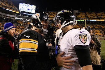 PITTSBURGH, PA - JANUARY 03:  Ben Roethlisberger #7 of the Pittsburgh Steelers meets Joe Flacco #5 of the Baltimore Ravens after the Ravens defeated the Steelers 30-17 in their AFC Wild Card game at Heinz Field on January 3, 2015 in Pittsburgh, Pennsylvan
