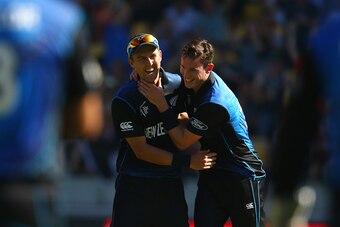 WELLINGTON, NEW ZEALAND - FEBRUARY 20:  Trent Boult and Adam Milne of New Zealand celebrate as the final England wicket falls during the 2015 ICC Cricket World Cup match between England and New Zealand at Wellington Regional Stadium on February 20, 2015 i