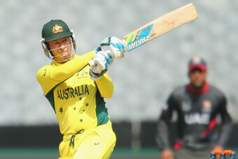 MELBOURNE, AUSTRALIA - FEBRUARY 11:  Michael Clarke of Australia hits a boundary during the Cricket World Cup warm up match between Australia and the United Arab Emirates at Melbourne Cricket Ground on February 11, 2015 in Melbourne, Australia.  (Photo by