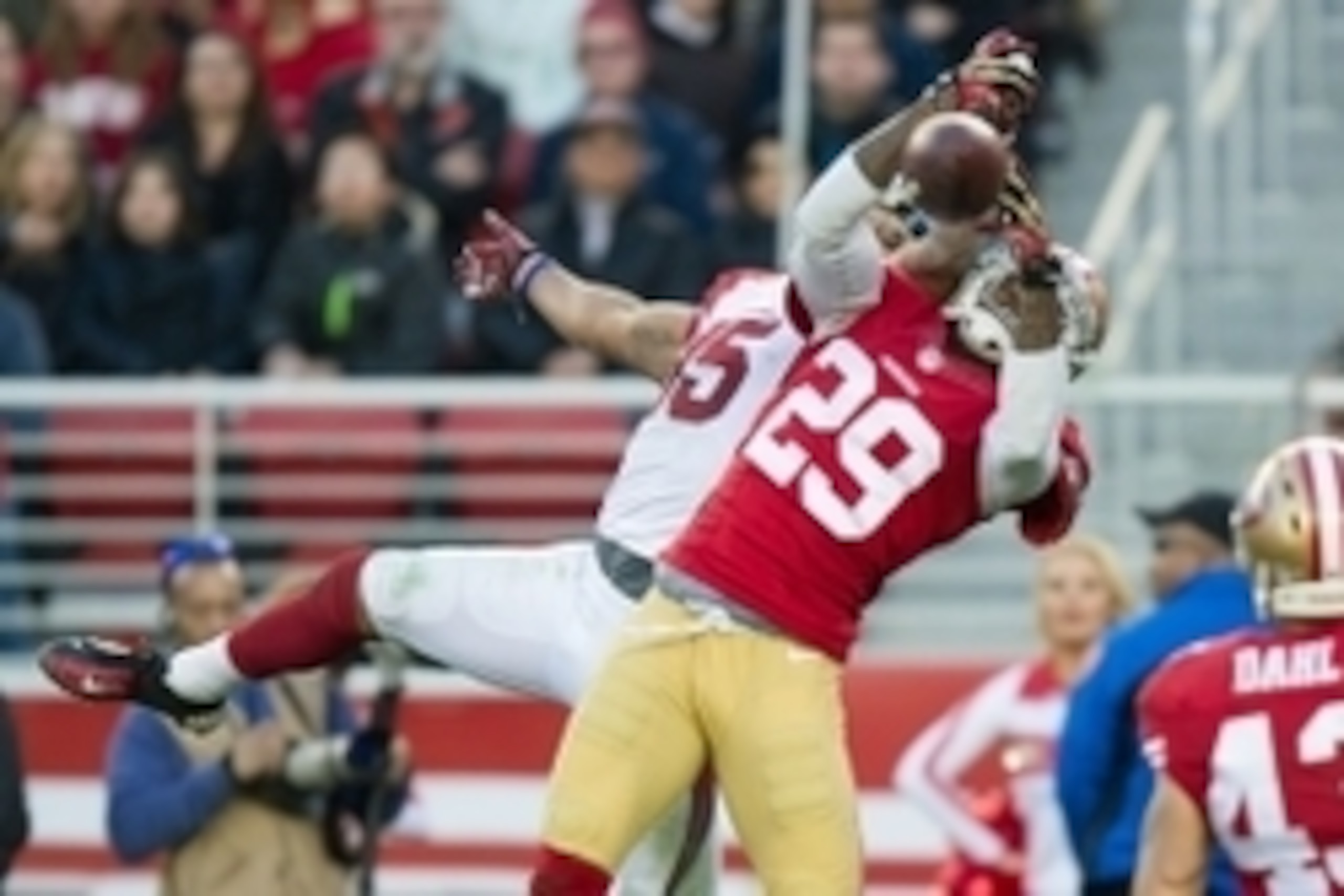 Dec 28, 2014; Santa Clara, CA, USA; San Francisco 49ers cornerback Chris Culliver (29) breaks up a pass to Arizona Cardinals wide receiver Michael Floyd (15) during the fourth quarter at Levi's Stadium. The against the San Francisco 49ers defeated the Ari