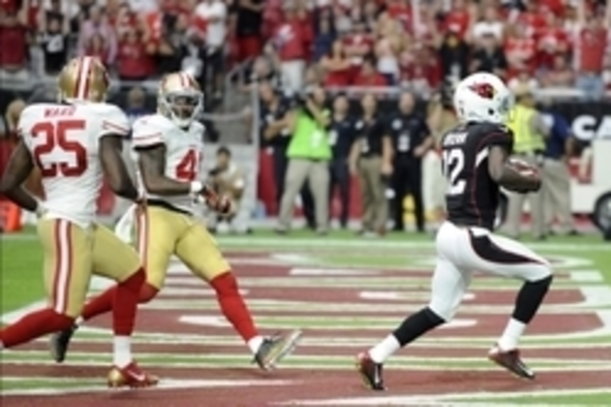 Sep 21, 2014; Glendale, AZ, USA; Arizona Cardinals wide receiver John Brown (12) catches a touchdown pass against the San Francisco 49ers during the second half at University of Phoenix Stadium. Mandatory Credit: Joe Camporeale-USA TODAY Sports