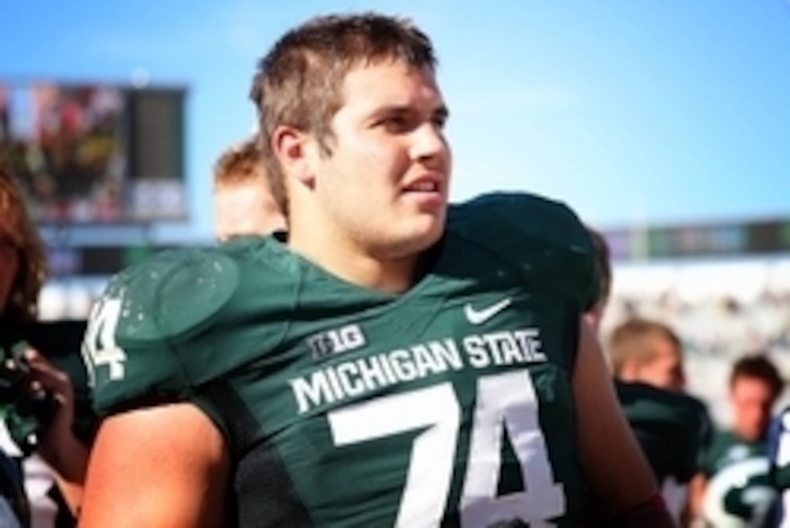 Oct 12, 2013; East Lansing, MI, USA; Michigan State Spartans offensive tackle Jack Conklin (74) celebrates the win after a game at Spartan Stadium. Mandatory Credit: Mike Carter-USA TODAY Sports