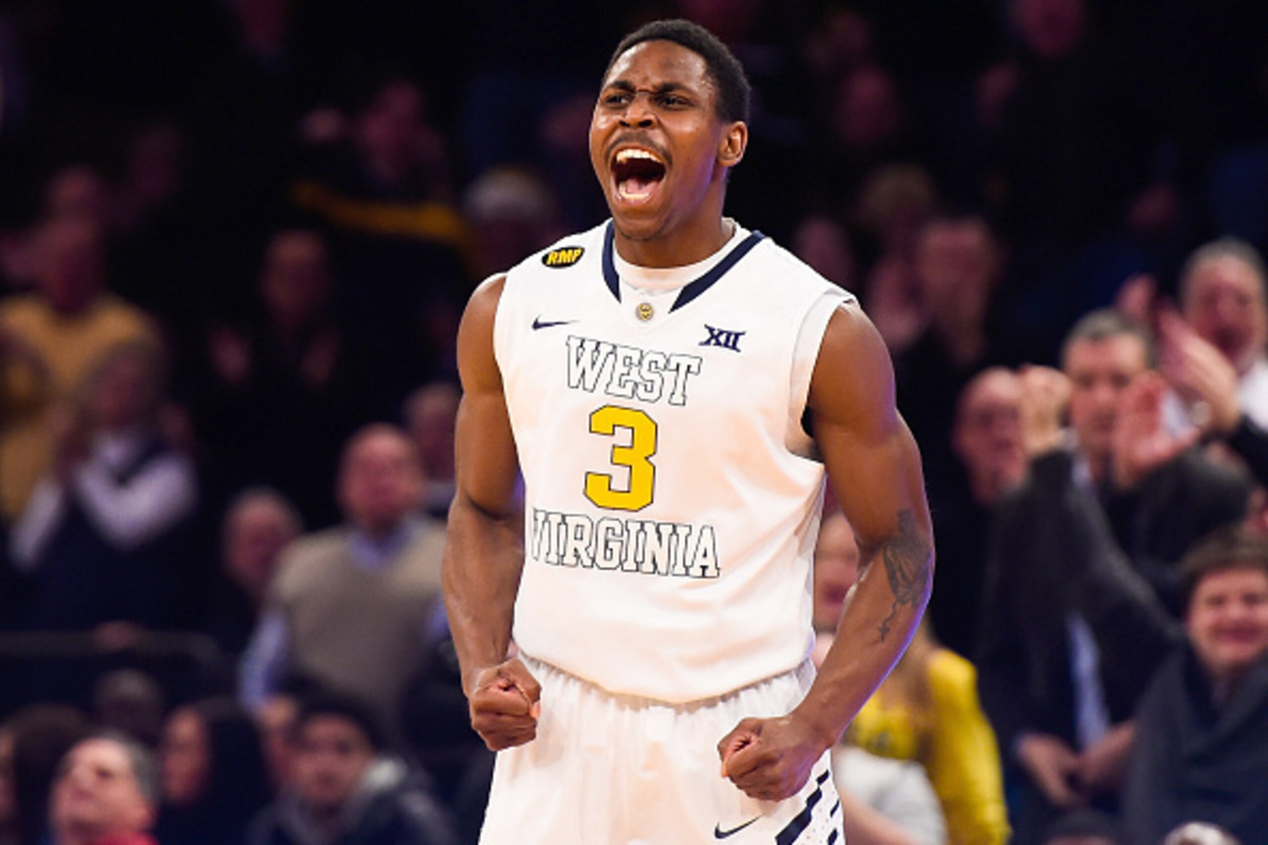 NEW YORK, NY - DECEMBER 20: Juwan Staten #3 of the West Virginia Mountaineers celebrates a basket in the first half during a game against the North Carolina State Wolfpack at Madison Square Garden on December 20, 2014 in New York City. (Photo by Alex Go NEW YORK, NY - DECEMBER 20: Juwan Staten #3 of the West Virginia Mountaineers celebrates a basket in the first half during a game against the North Carolina State Wolfpack at Madison Square Garden on December 20, 2014 in New York City. (Photo by Alex Go