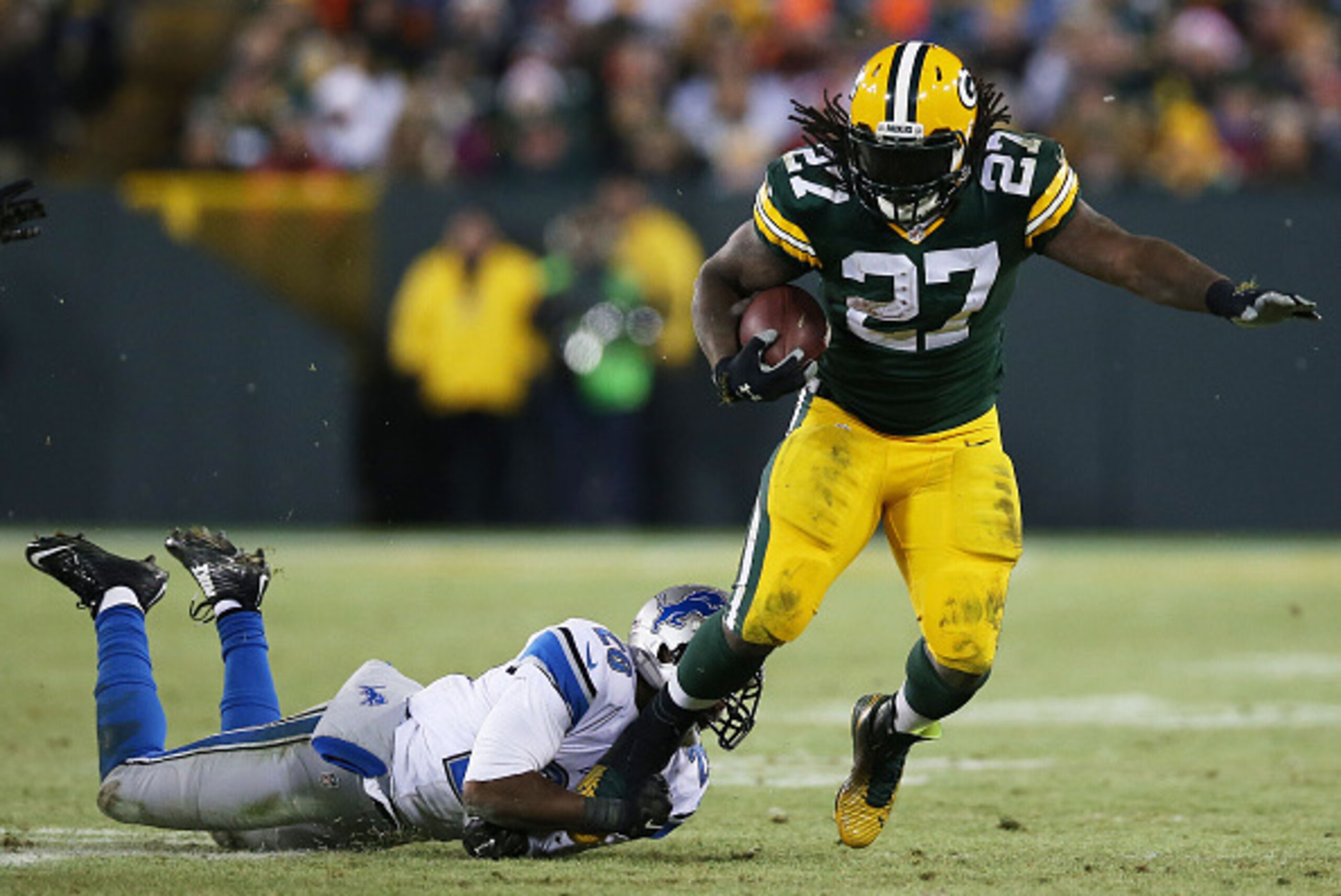 GREEN BAY, WI - DECEMBER 28: Eddie Lacy #27 of the Green Bay Packers tries to avoid the tackle of Don Carey #26 of the Detroit Lions in the fourth quarter at Lambeau Field on December 28, 2014 in Green Bay, Wisconsin. (Photo by Chris Graythen/Getty Ima GREEN BAY, WI - DECEMBER 28: Eddie Lacy #27 of the Green Bay Packers tries to avoid the tackle of Don Carey #26 of the Detroit Lions in the fourth quarter at Lambeau Field on December 28, 2014 in Green Bay, Wisconsin. (Photo by Chris Graythen/Getty Ima