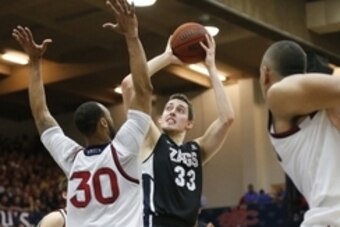 Feb 21, 2015; Moraga, CA, USA;  Gonzaga Bulldogs forward Kyle Wiltjer (33) shoots the ball over St. Mary's Gaels forward Desmond Simmons (30) during the first half at McKeon Pavilion. Mandatory Credit: Bob Stanton-USA TODAY Sports