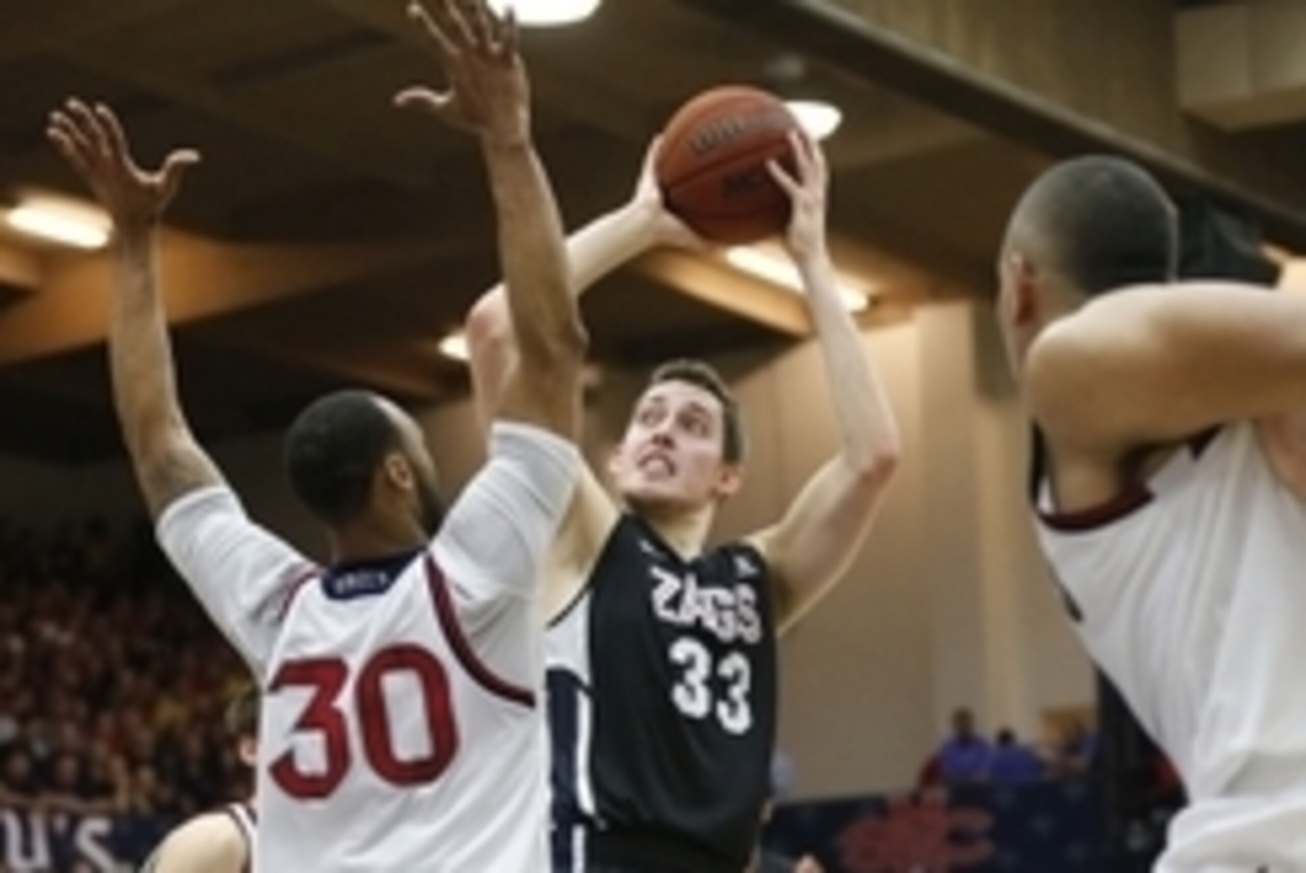 Feb 21, 2015; Moraga, CA, USA;  Gonzaga Bulldogs forward Kyle Wiltjer (33) shoots the ball over St. Mary's Gaels forward Desmond Simmons (30) during the first half at McKeon Pavilion. Mandatory Credit: Bob Stanton-USA TODAY Sports