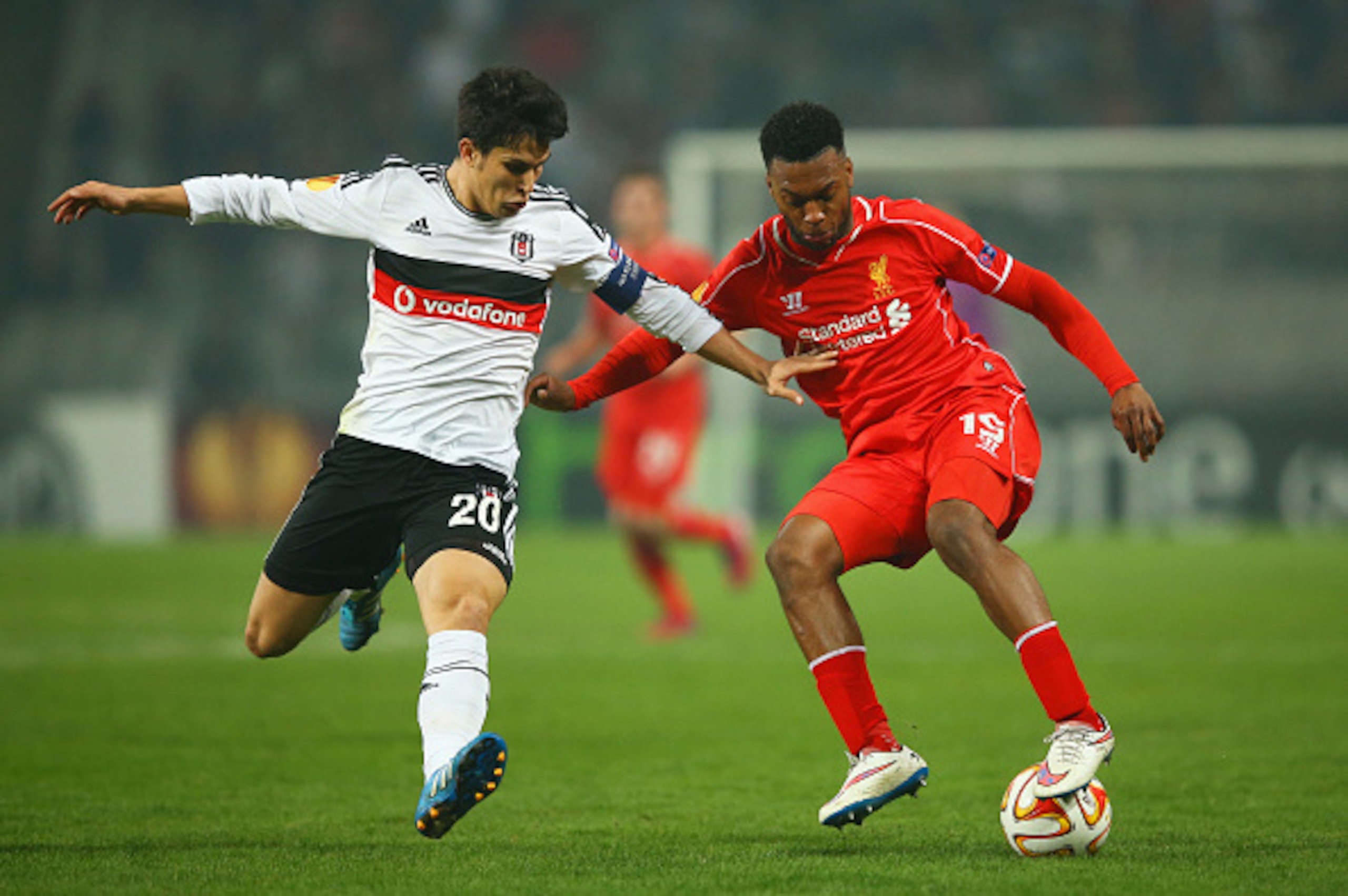 ISTANBUL, TURKEY - FEBRUARY 26: Daniel Sturridge of Liverpool takes on Necip Uysal of Besiktas during the UEFA Europa League Round of 32 second leg match between Besiktas JK and Liverpool FC on February 26, 2015 in Istanbul, Turkey. (Photo by Richard He ISTANBUL, TURKEY - FEBRUARY 26: Daniel Sturridge of Liverpool takes on Necip Uysal of Besiktas during the UEFA Europa League Round of 32 second leg match between Besiktas JK and Liverpool FC on February 26, 2015 in Istanbul, Turkey. (Photo by Richard He