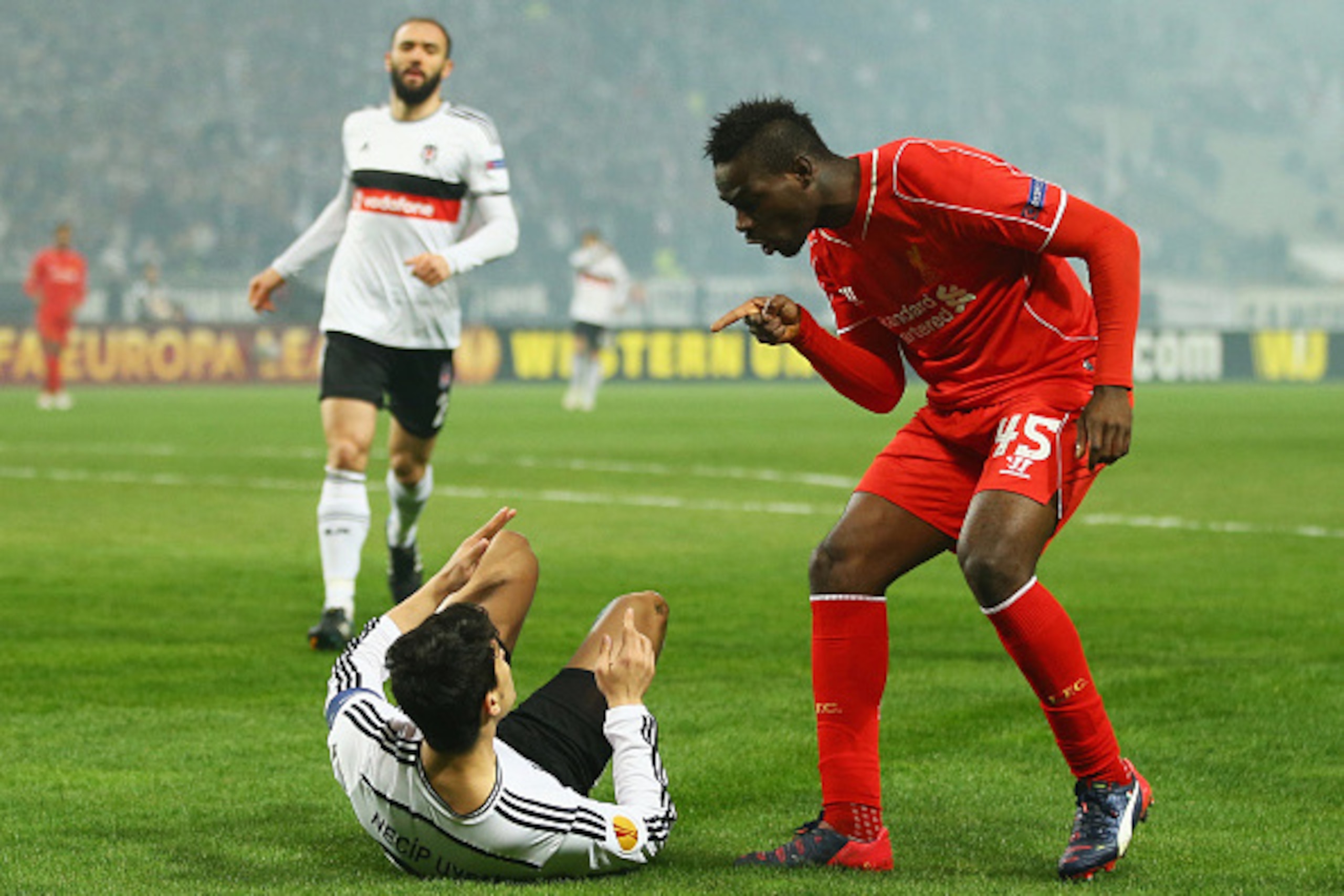 ISTANBUL, TURKEY - FEBRUARY 26: Mario Balotelli of Liverpool clashes with Necip Uysal of Besiktas during the UEFA Europa League Round of 32 second leg match between Besiktas JK and Liverpool FC on February 26, 2015 in Istanbul, Turkey. (Photo by Richard ISTANBUL, TURKEY - FEBRUARY 26: Mario Balotelli of Liverpool clashes with Necip Uysal of Besiktas during the UEFA Europa League Round of 32 second leg match between Besiktas JK and Liverpool FC on February 26, 2015 in Istanbul, Turkey. (Photo by Richard