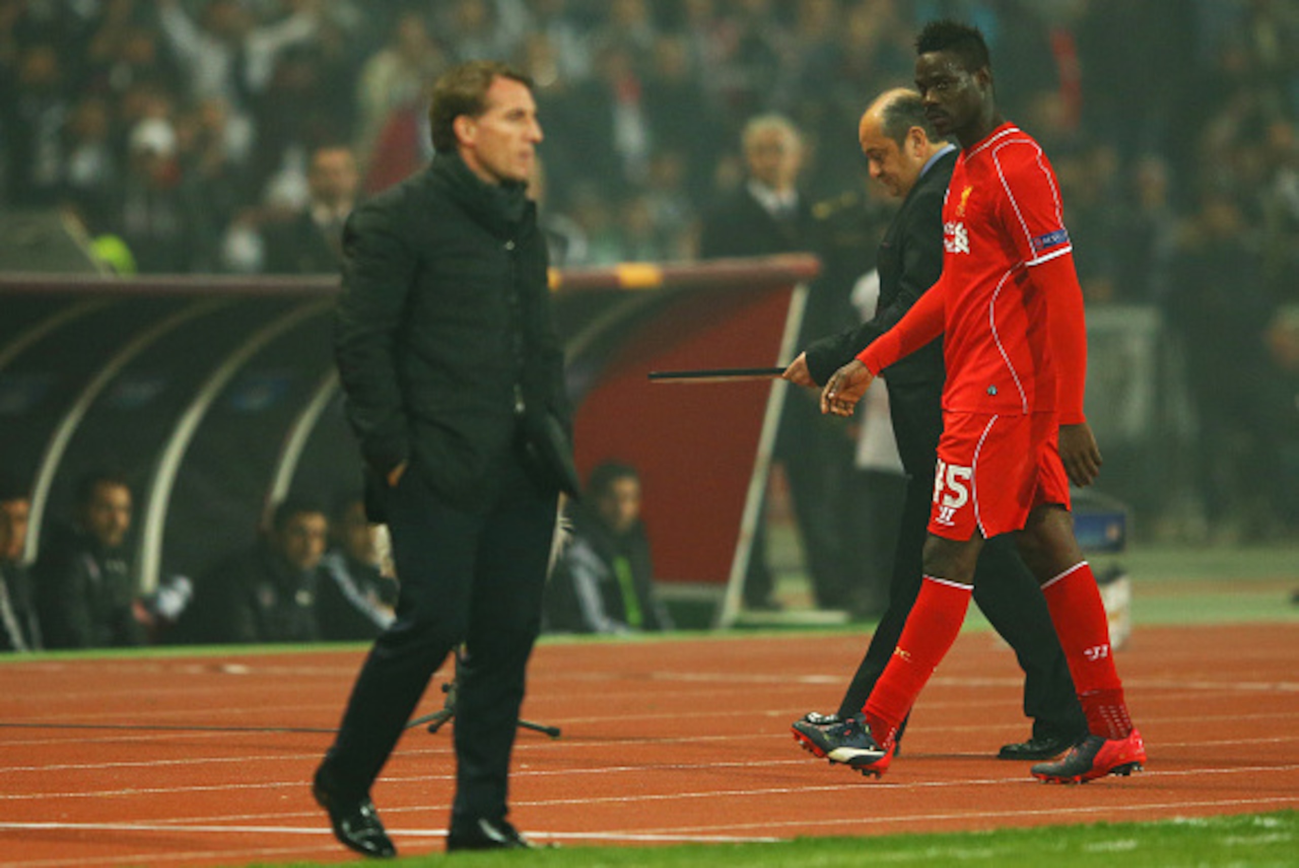 ISTANBUL, TURKEY - FEBRUARY 26: Mario Balotelli of Liverpool looks across as Brendan Rodgers manager of Liverpool as he is substituted during the UEFA Europa League Round of 32 second leg match between Besiktas JK and Liverpool FC on February 26, 2015 in ISTANBUL, TURKEY - FEBRUARY 26: Mario Balotelli of Liverpool looks across as Brendan Rodgers manager of Liverpool as he is substituted during the UEFA Europa League Round of 32 second leg match between Besiktas JK and Liverpool FC on February 26, 2015 in
