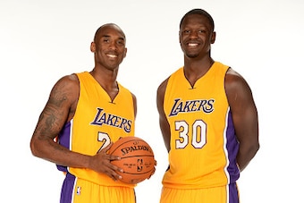 EL SEGUNDO, CA - SEPTEMBER 29: Kobe Bryant #24, and Julius Randle #30 of the Los Angeles Lakers pose for a portrait during the Los Angeles Lakers Media Day at the Toyota Sports Center on September 29, 2014 in El Segundo, California. NOTE TO USER: User exp
