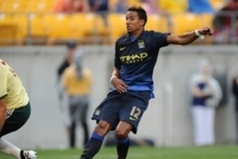 Jul 27, 2014; Pittsburgh, PA, USA; Manchester City midfielder Scott Sinclair (12) watches as he scores against AC Milan during the first half of a friendly at Heinz Field. Mandatory Credit: Don Wright-USA TODAY Sports