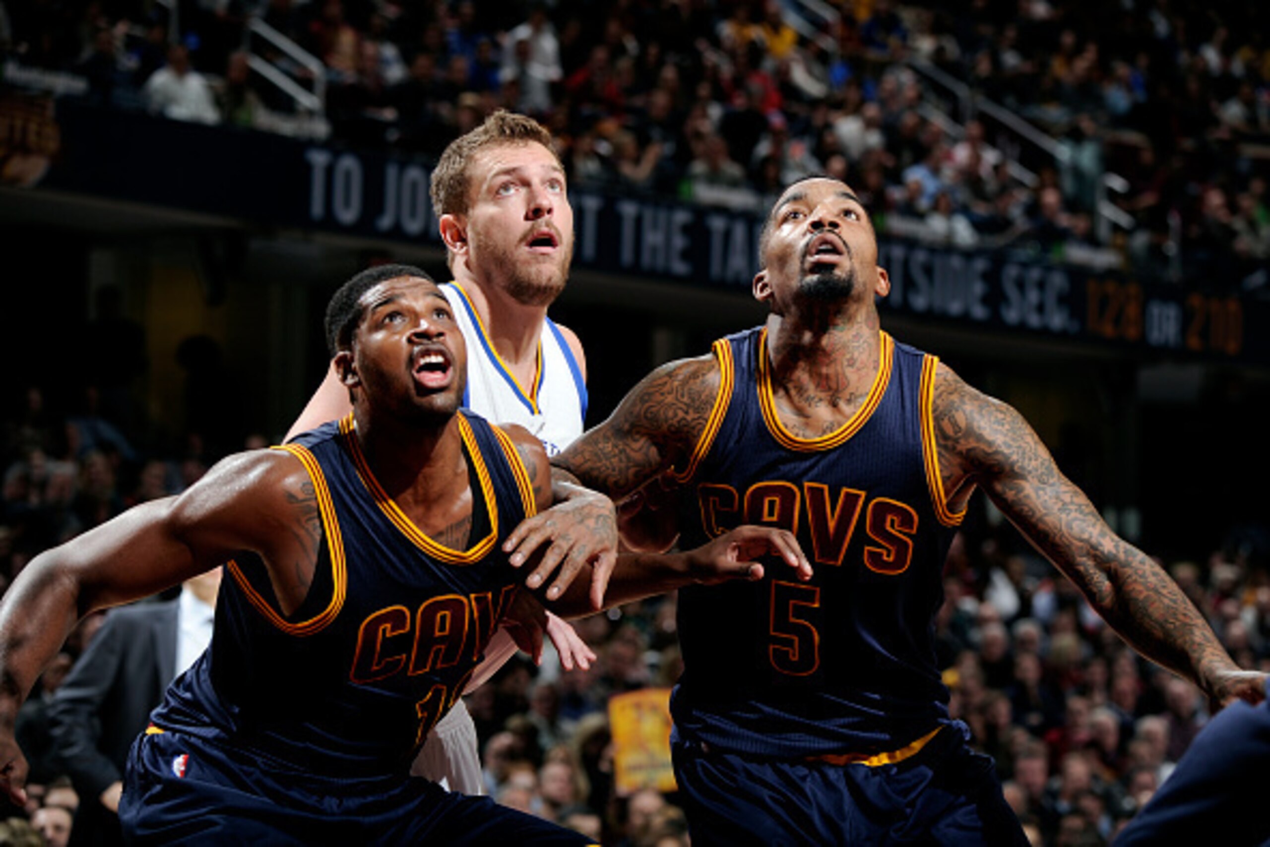 CLEVELAND, OH - FEBRUARY 26: Tristan Thompson #13 and J.R. Smith #5 of the Cleveland Cavaliers battle for position against David Lee #10 of the Golden State Warriors at The Quicken Loans Arena on February 26, 2015 in Cleveland, Ohio. NOTE TO USER: User ex
