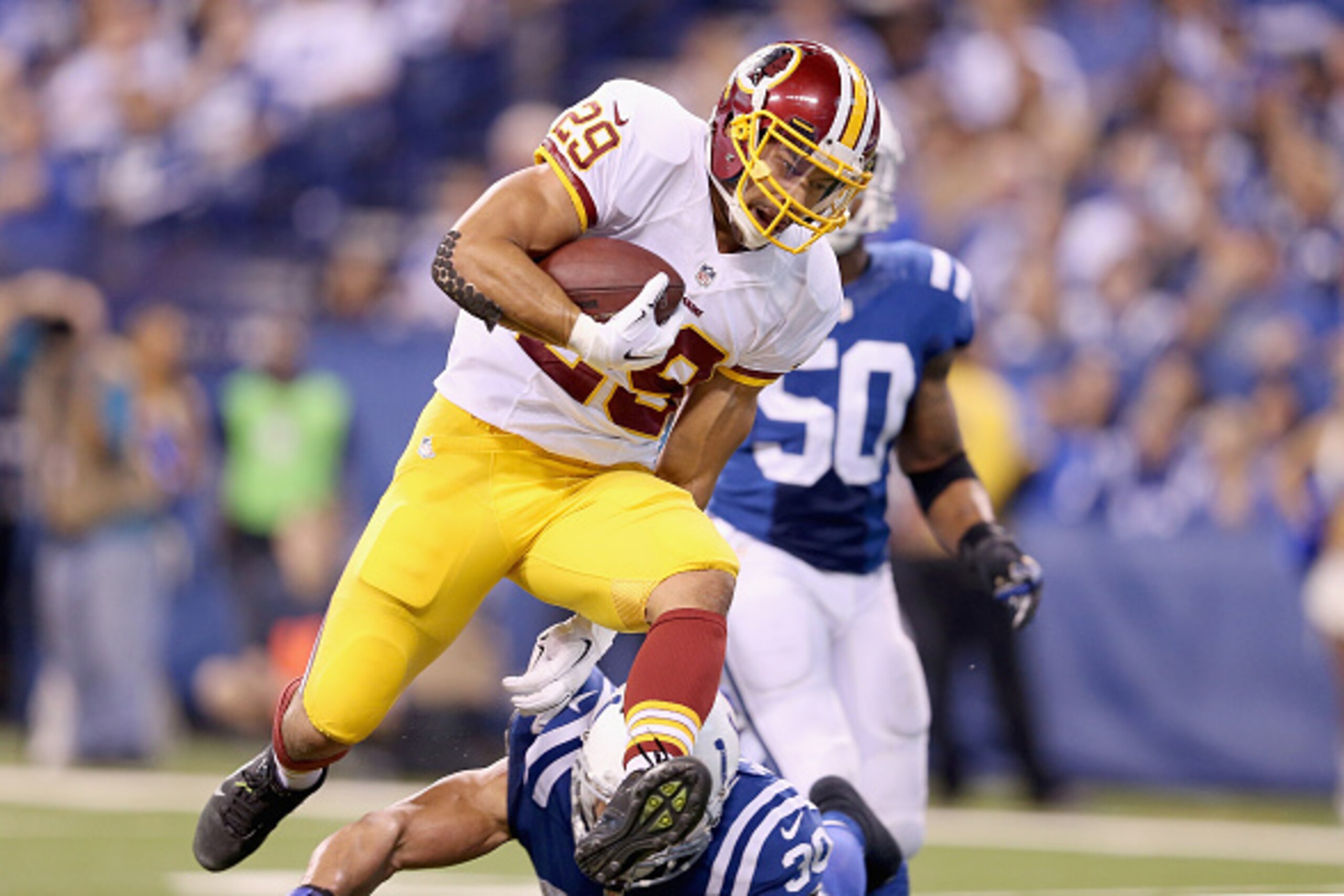 INDIANAPOLIS, IN - NOVEMBER 30:  Roy Helu Jr. #29 of the Washington Redskins runs for a touchdown during the game against the Indianapolis Colts at Lucas Oil Stadium on November 30, 2014 in Indianapolis, Indiana.  (Photo by Andy Lyons/Getty Images)