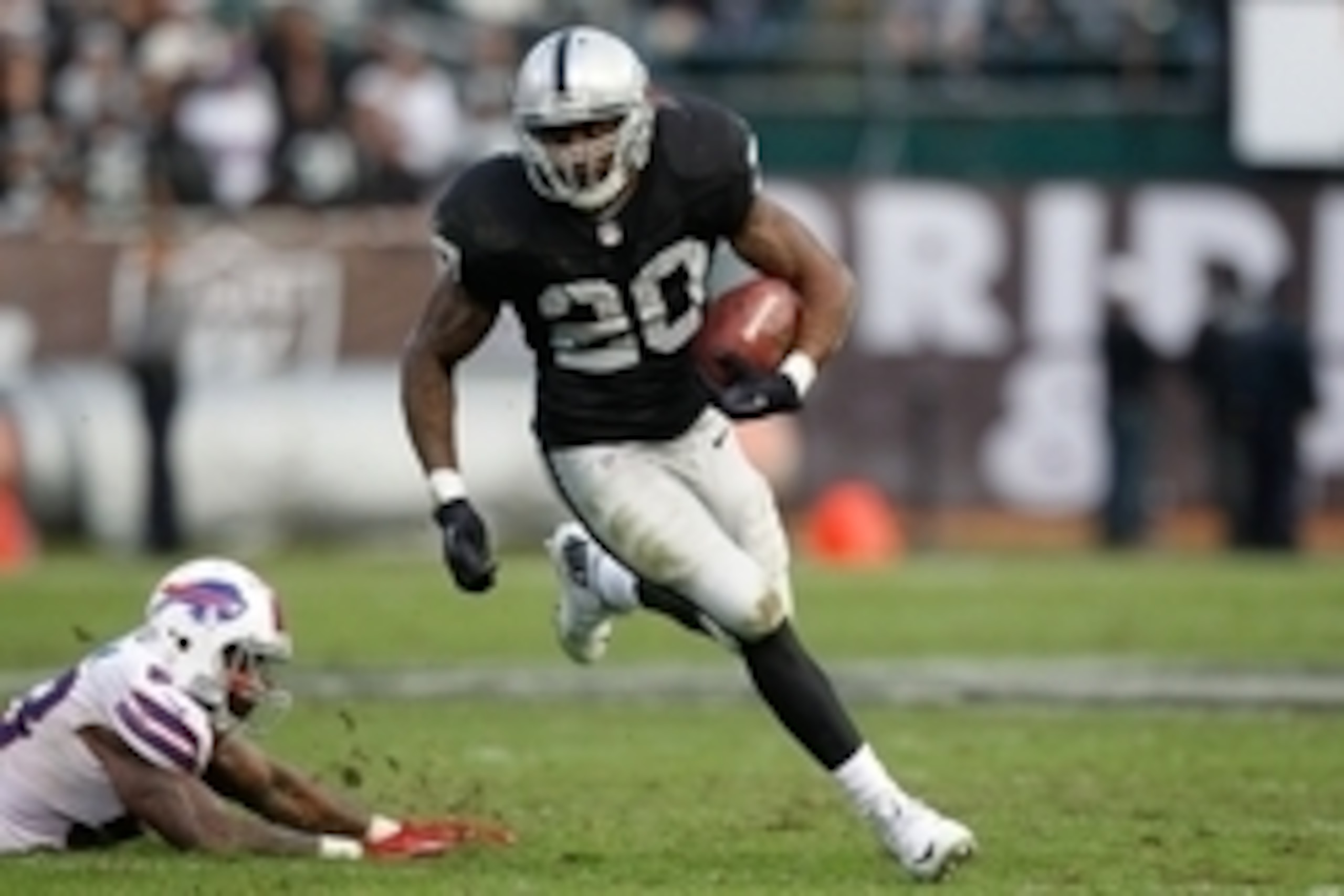 Dec 21, 2014; Oakland, CA, USA; Oakland Raiders running back Darren McFadden (20) runs the ball against the Buffalo Bills in the fourth quarter at O.co Coliseum. The Raiders defeated the Bills 26-24. Mandatory Credit: Cary Edmondson-USA TODAY Sports