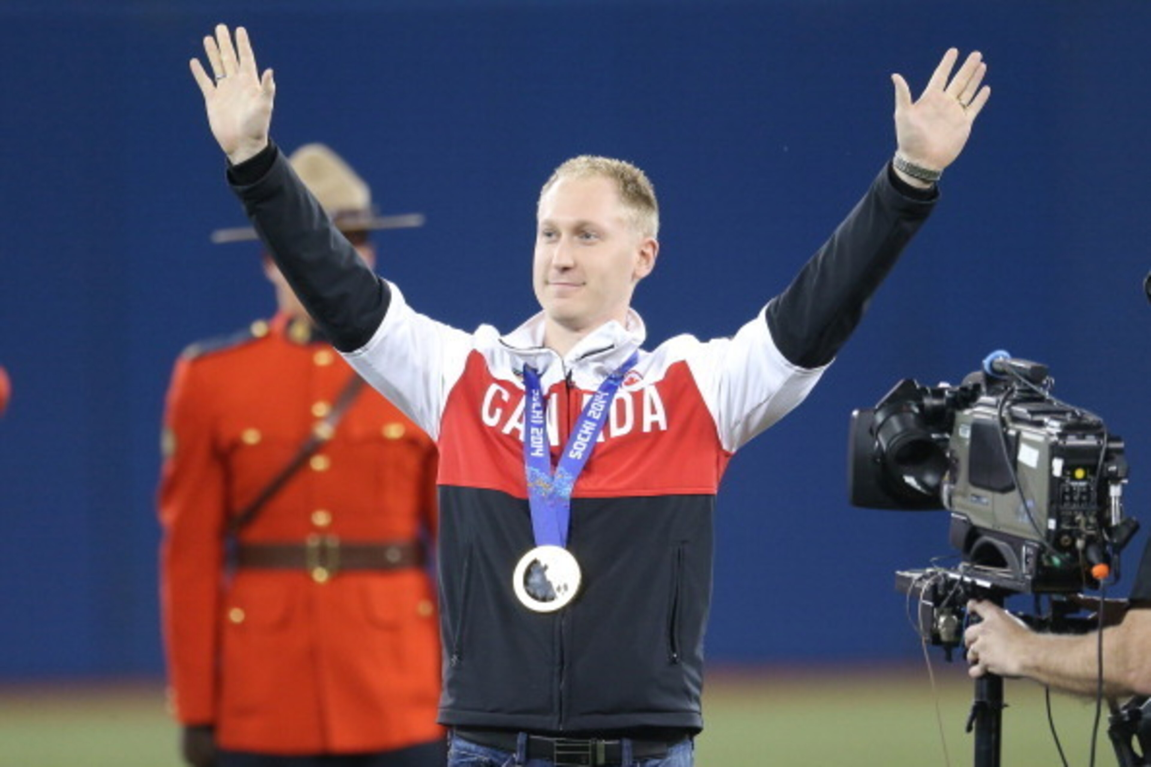 TORONTO, CANADA - APRIL 4: Brad Jacobs who won gold in men's curling at the Winter Olympic Games in Sochi is introduced before the Toronto Blue Jays MLB game against the New York Yankees on April 4, 2014 at Rogers Centre in Toronto, Ontario, Canada. (Phot TORONTO, CANADA - APRIL 4: Brad Jacobs who won gold in men's curling at the Winter Olympic Games in Sochi is introduced before the Toronto Blue Jays MLB game against the New York Yankees on April 4, 2014 at Rogers Centre in Toronto, Ontario, Canada. (Phot
