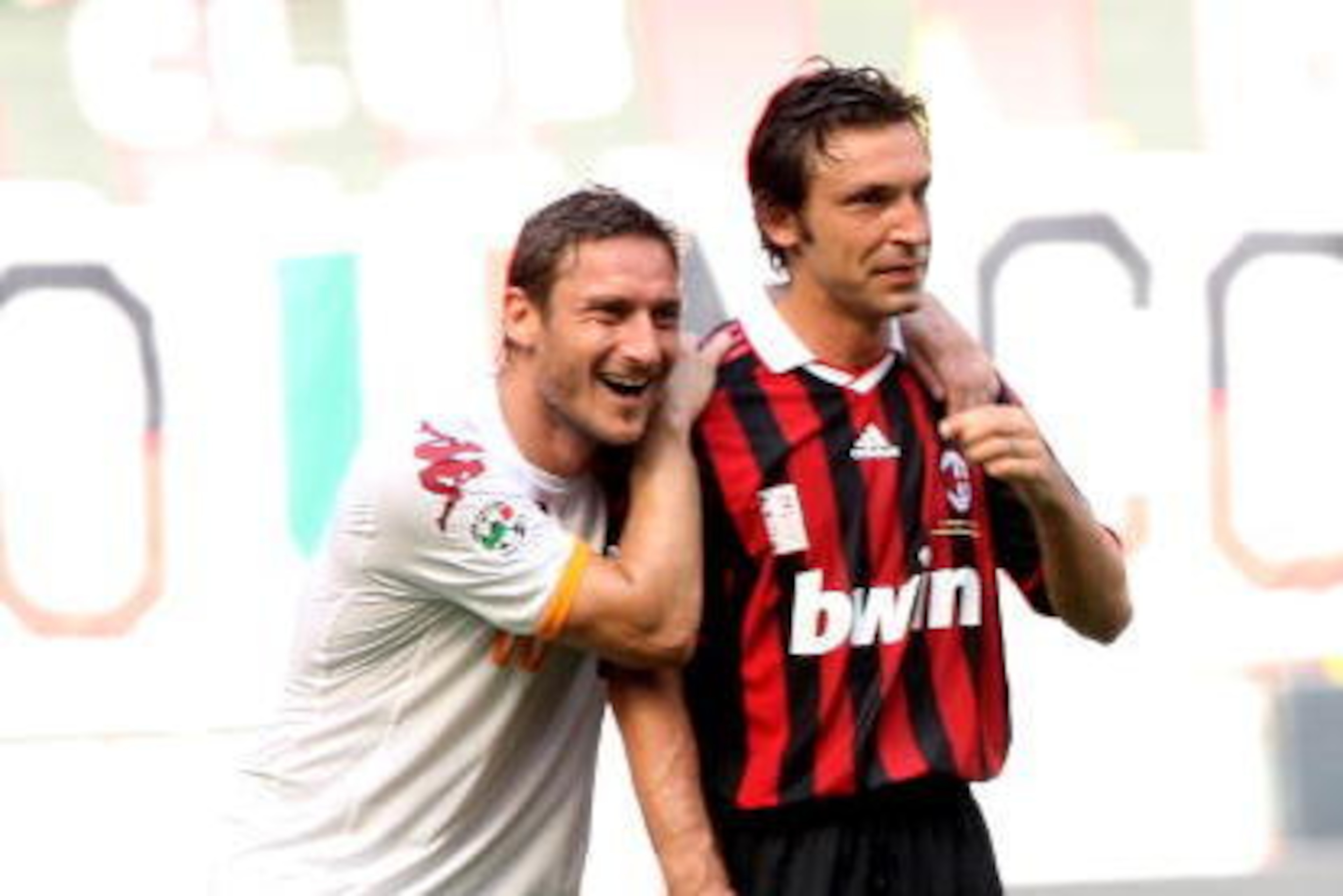 MILAN, ITALY - MAY 24:  Francesco Totti (L) and Andrea Pirlo smile during AC Milan v AS Roma on May 24, 2009 in Milan, Italy.  (Photo by Vittorio Zunino Celotto/Getty Images)