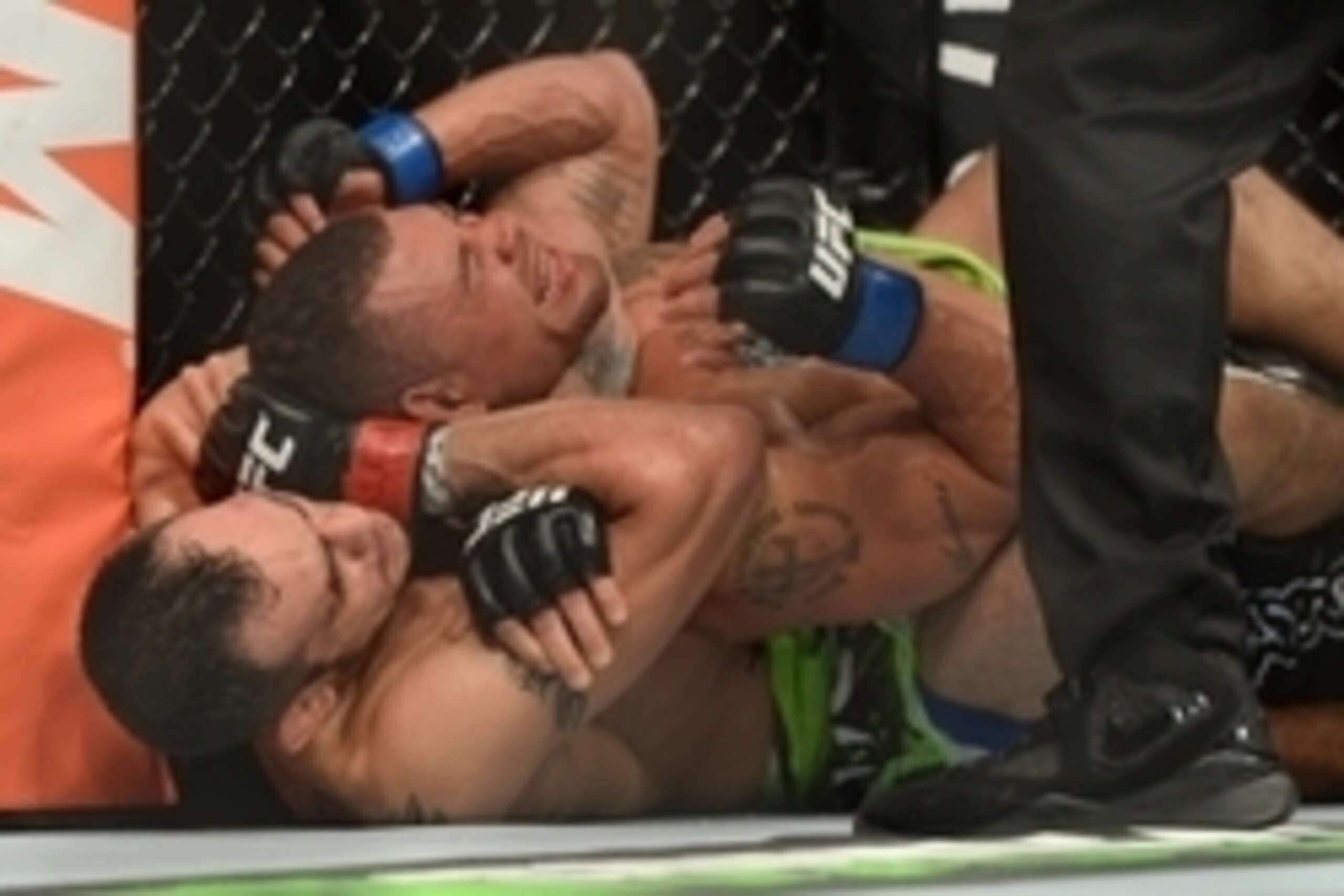 Dec 6, 2014; Las Vegas, NV, USA; Tony Ferguson (red) submits Abel Trujillo (blue) during UFC 181 at Madalay Bay Events Center. Ferguson won via second round submission. Mandatory Credit: Joe Camporeale-USA TODAY Sports