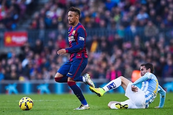 BARCELONA, SPAIN - FEBRUARY 21:  Neymar of FC Barcelona competes for the ball with Sergio P. Barbosa 'Duda' of Malaga CF during the La Liga match between FC Barcelona and Malaga CF at Camp Nou on February 21, 2015 in Barcelona, Spain.  (Photo by David Ram