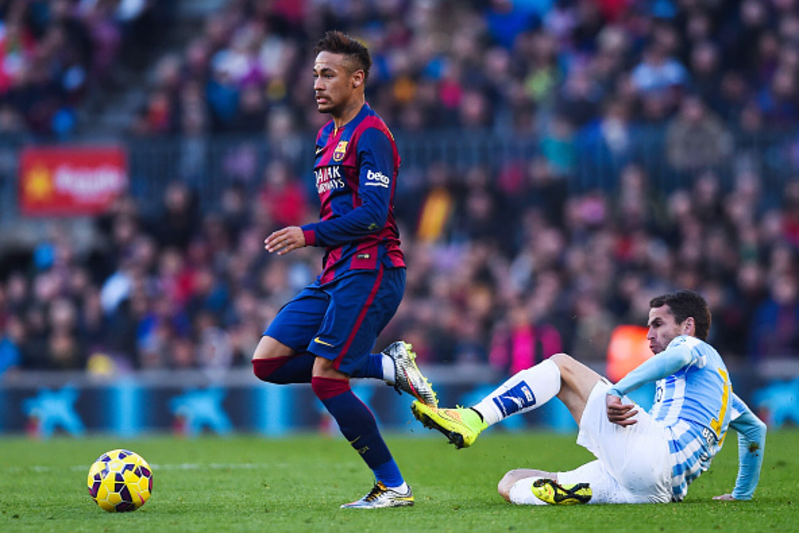 BARCELONA, SPAIN - FEBRUARY 21:  Neymar of FC Barcelona competes for the ball with Sergio P. Barbosa 'Duda' of Malaga CF during the La Liga match between FC Barcelona and Malaga CF at Camp Nou on February 21, 2015 in Barcelona, Spain.  (Photo by David Ram