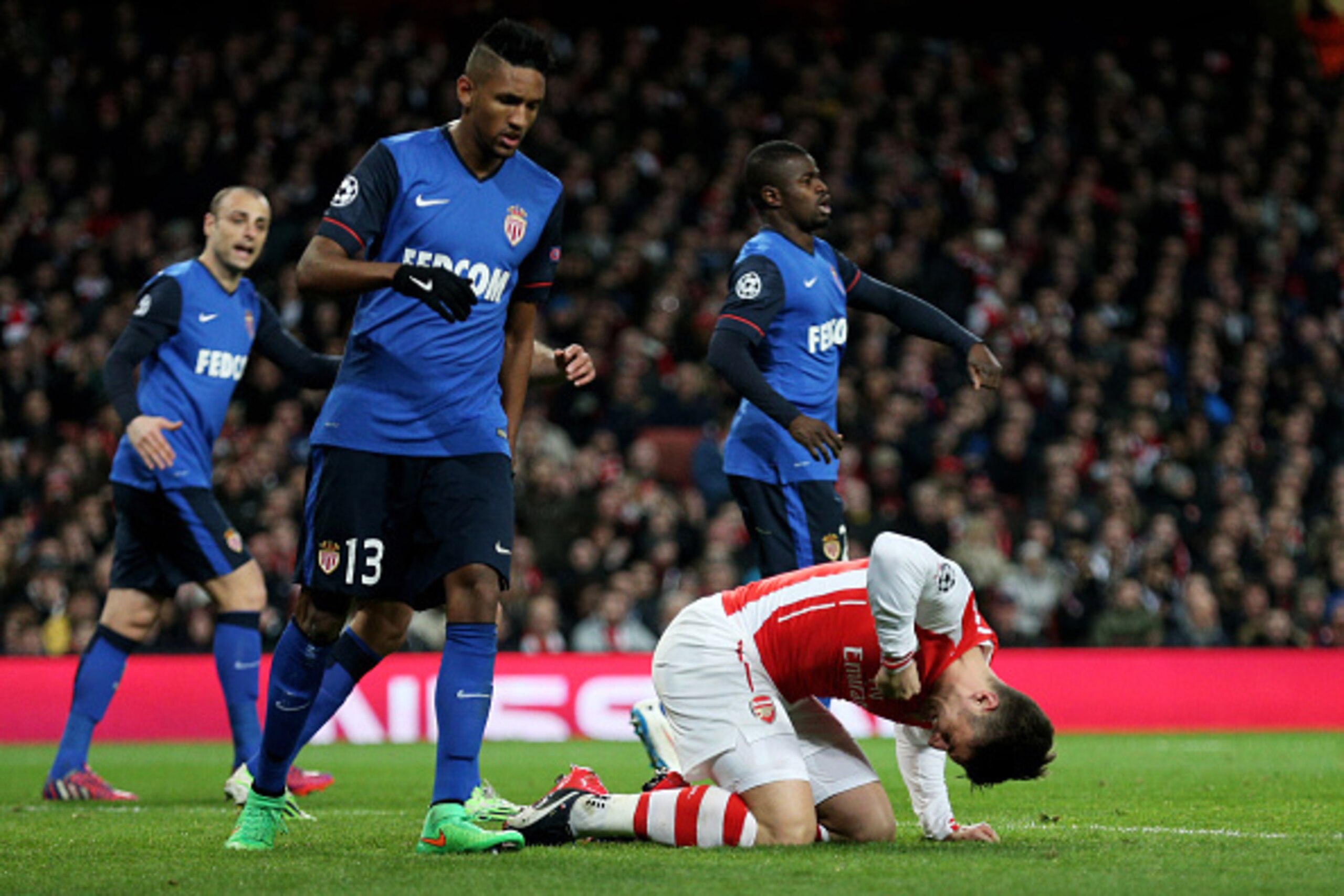 LONDON, ENGLAND - FEBRUARY 25:  Robert Giroud of Arsenal punches the grounds after missing a chance on goal during the UEFA Champions League round of 16, first leg match between Arsenal and Monaco at The Emirates Stadium on February 25, 2015 in London, Un