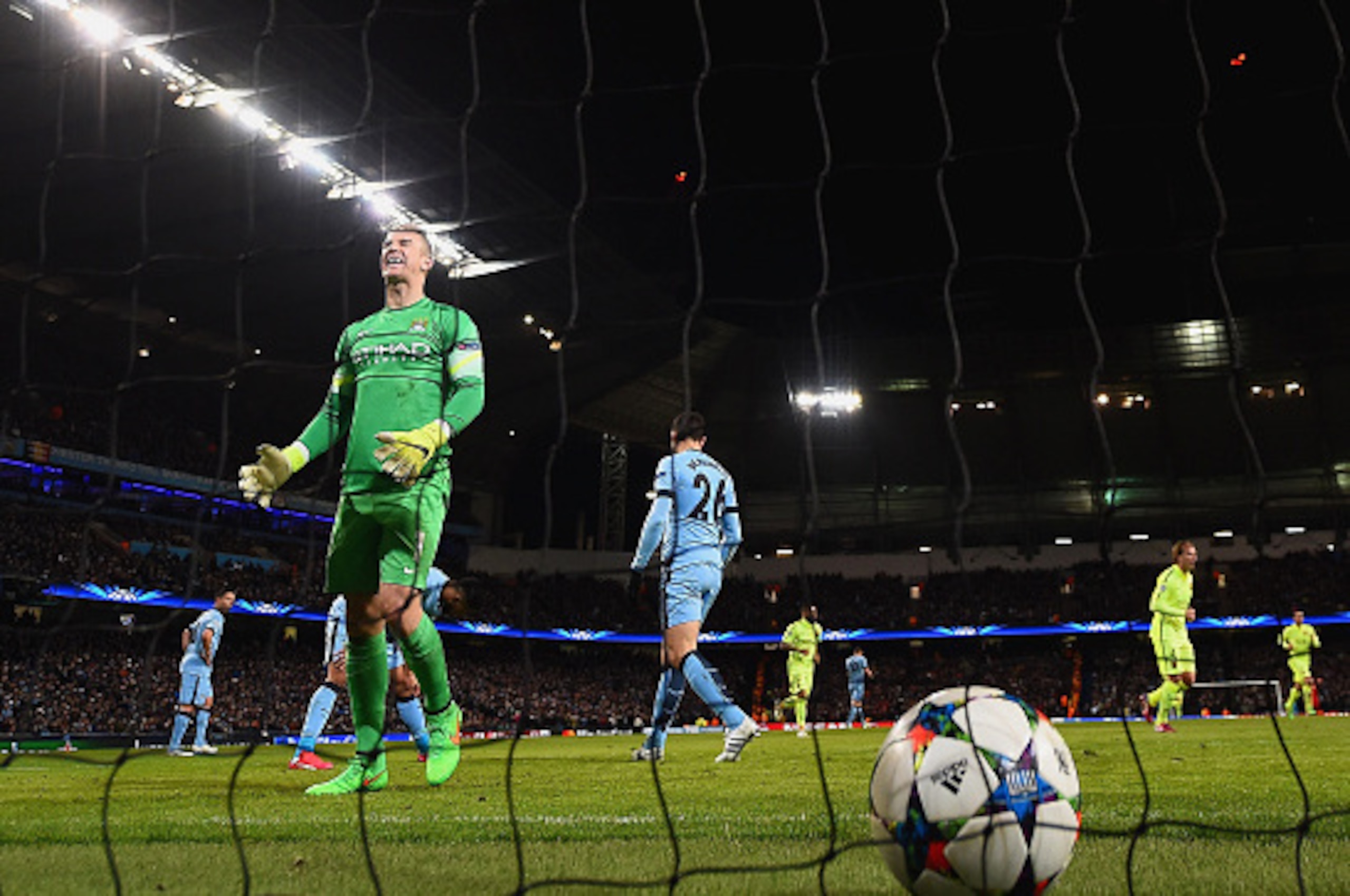 MANCHESTER, ENGLAND - FEBRUARY 24:  Joe Hart of Manchester City shows his frustration after Luis Suarez of Barcelona (not pictured) scored a second goal during the UEFA Champions League Round of 16 match between Manchester City and Barcelona at Etihad Sta
