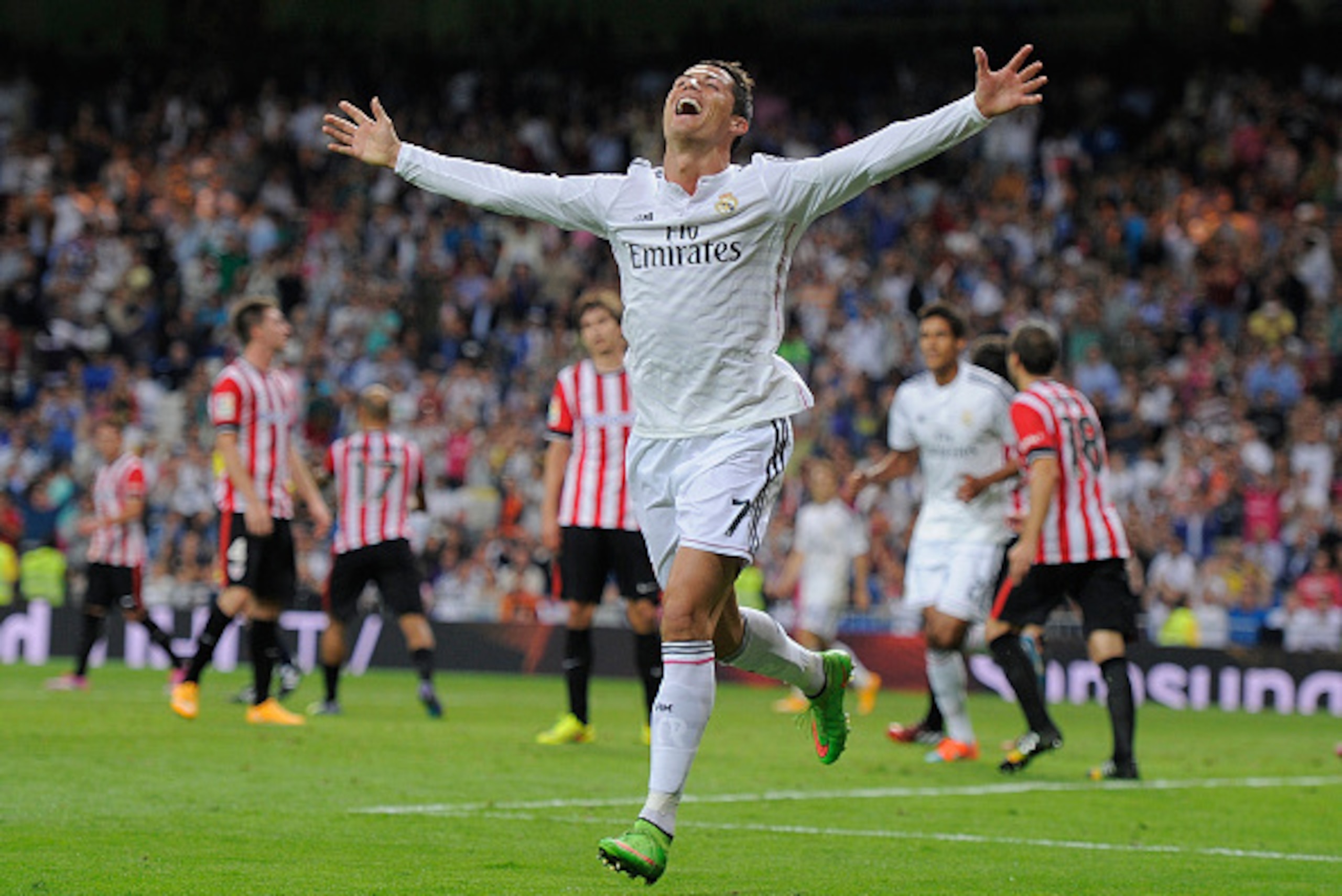 MADRID, SPAIN - OCTOBER 05:  Cristiano Ronaldo of Real Madrid celebrates after scoring his team's 5th and his third goal against Club Athletic during the La Liga match between Real Madrid CF and Athletic Club at Estadio Santiago Bernabeu on October 5, 201