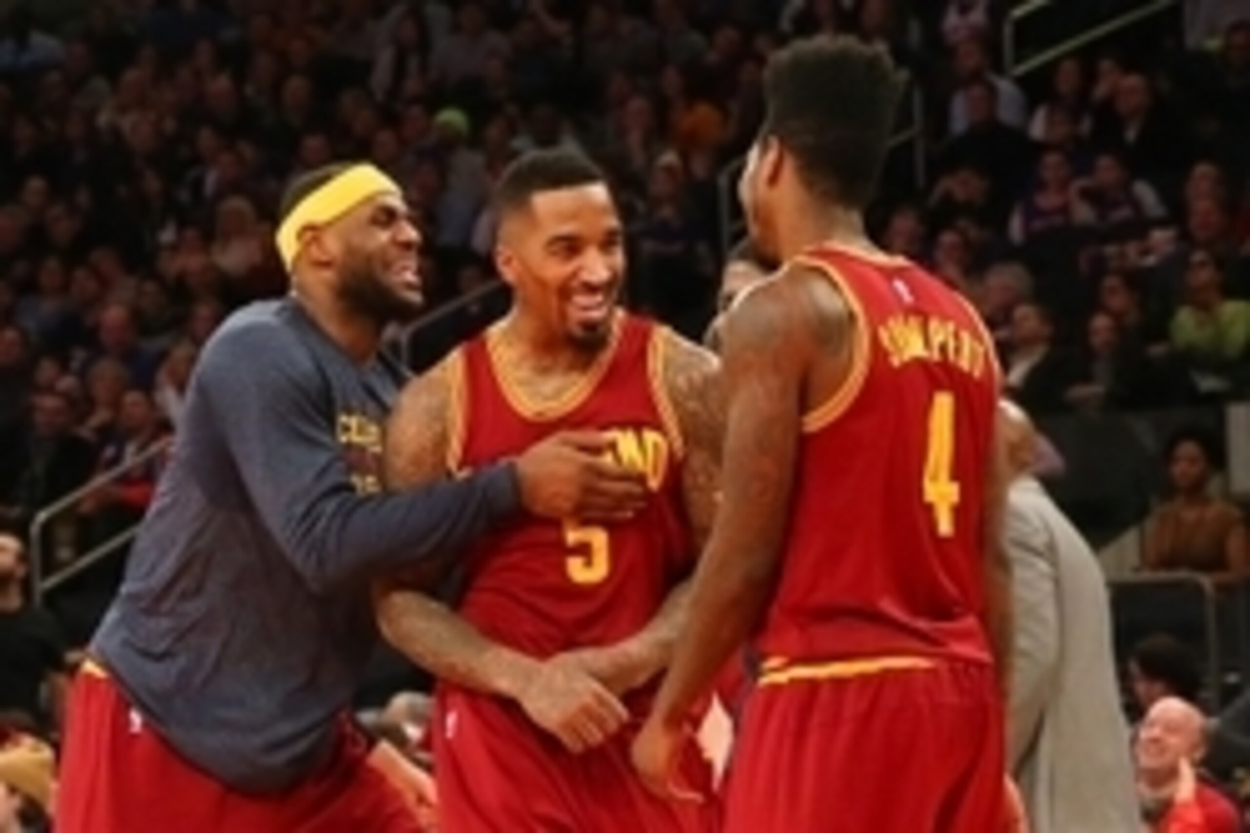 Feb 22, 2015; New York, NY, USA;  Cleveland Cavaliers forward LeBron James (23) comes off the bench reacting to guard J.R. Smith (5) reverse dunk during the fourth quarter against the New York Knicks at Madison Square Garden. Cleveland Cavaliers won 101-8