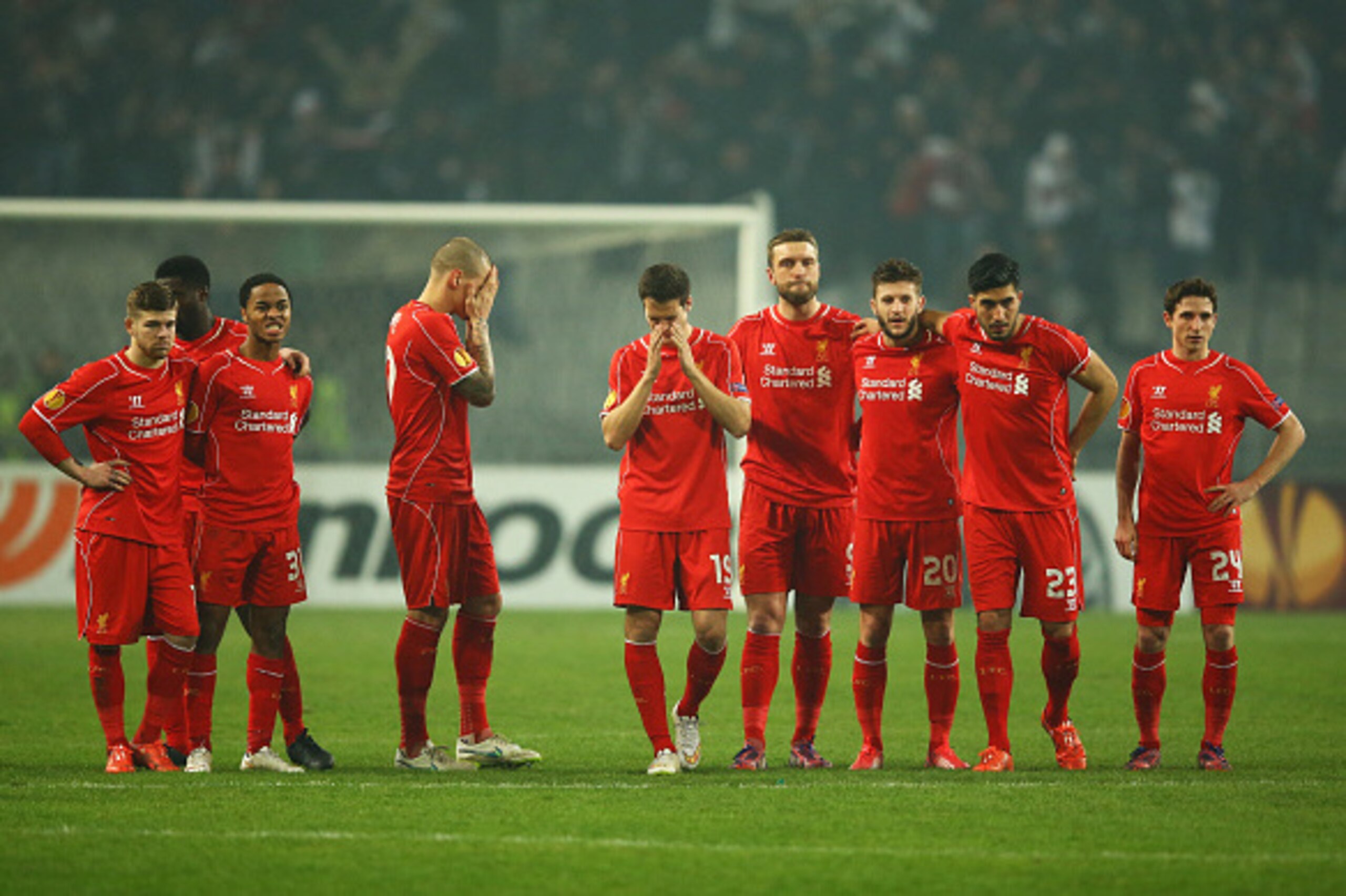 ISTANBUL, TURKEY - FEBRUARY 26:  Liverpool players look dejected as Dejan Lovren of Liverpool misses the decisive kick in the penalty shoot out during the UEFA Europa League Round of 32 second leg match between Besiktas JK and Liverpool FC on February 26,