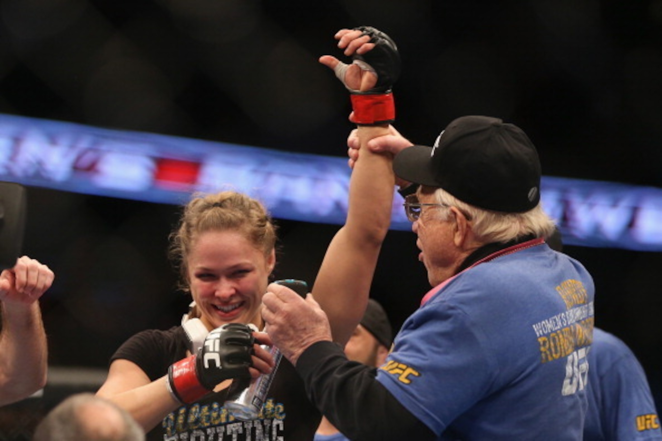 ANAHEIM, CA - FEBRUARY 23:  Ronda Rousey celebrates her UFC Bantamweight Title over Liz Carmouche with a member of her team during UFC 157 at Honda Center on February 23, 2013 in Anaheim, California.  (Photo by Jeff Gross/Getty Images)