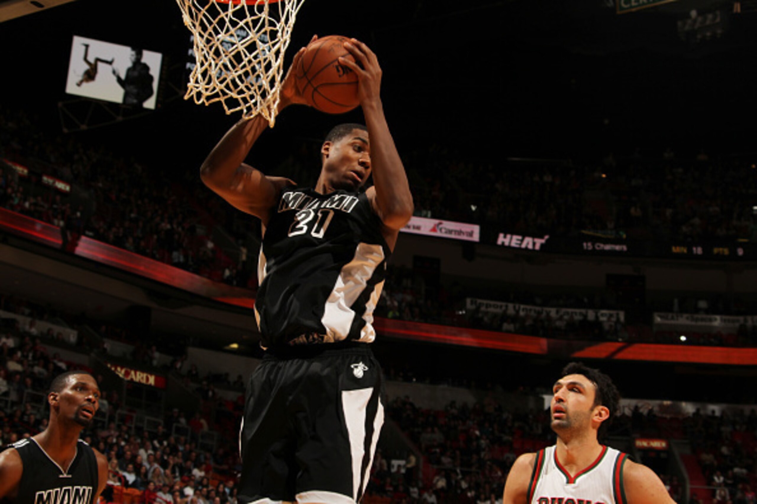 MIAMI, FL - JANUARY 27:  Hassan Whiteside #21 of the Miami Heat grabs the rebound against the Milwaukee Bucks on January 27, 2015  at American Airlines Arena in Miami, Florida.  NOTE TO USER: User expressly acknowledges and agrees that, by downloading and